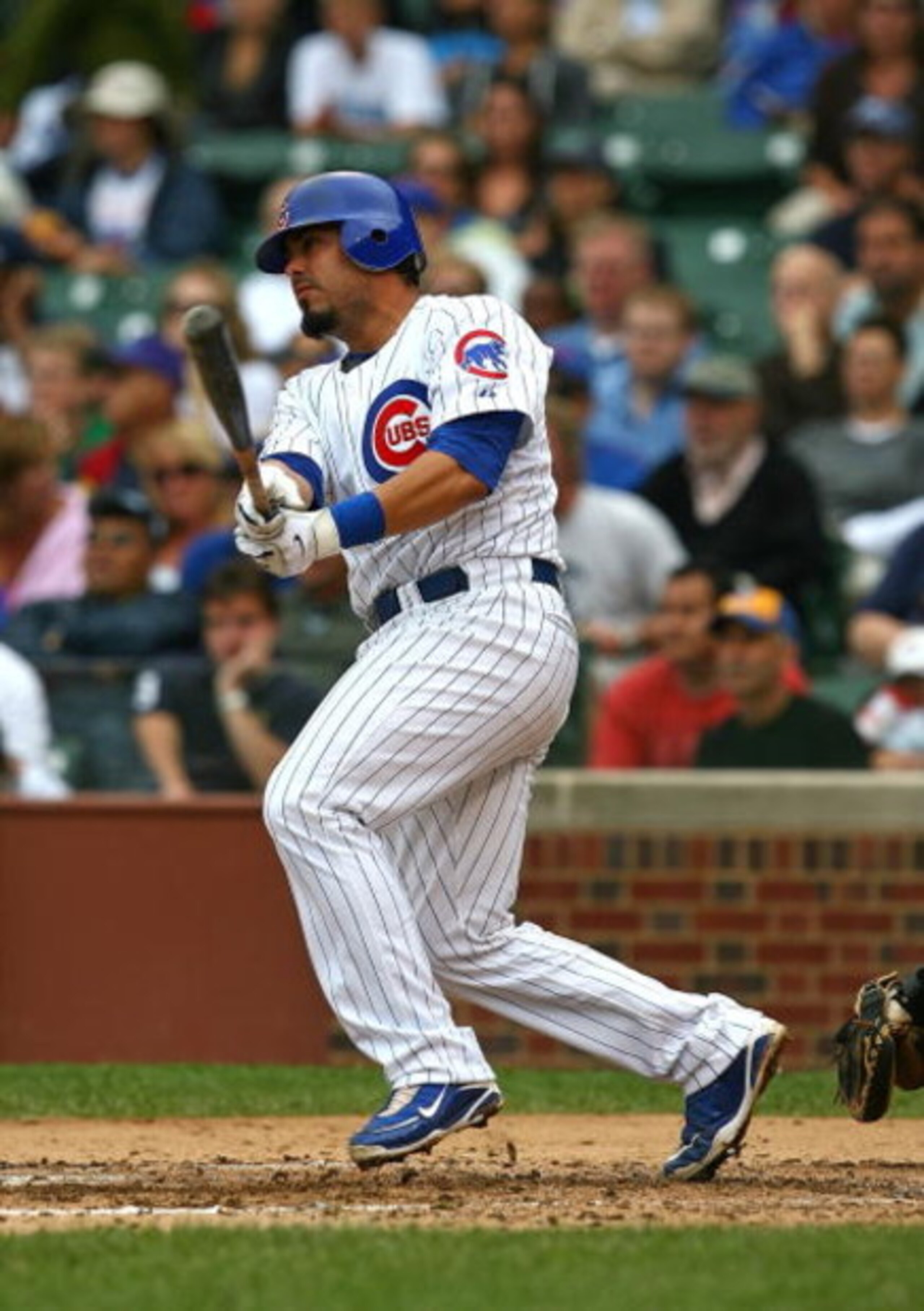 CHICAGO - AUGUST 28: Geovany Soto #18 of the Chicago Cubs hits the ball against the New York Mets on August 28, 2009 at Wrigley Field in Chicago, Illinois. The Cubs defeated the Mets 5-2. (Photo by Jonathan Daniel/Getty Images)
