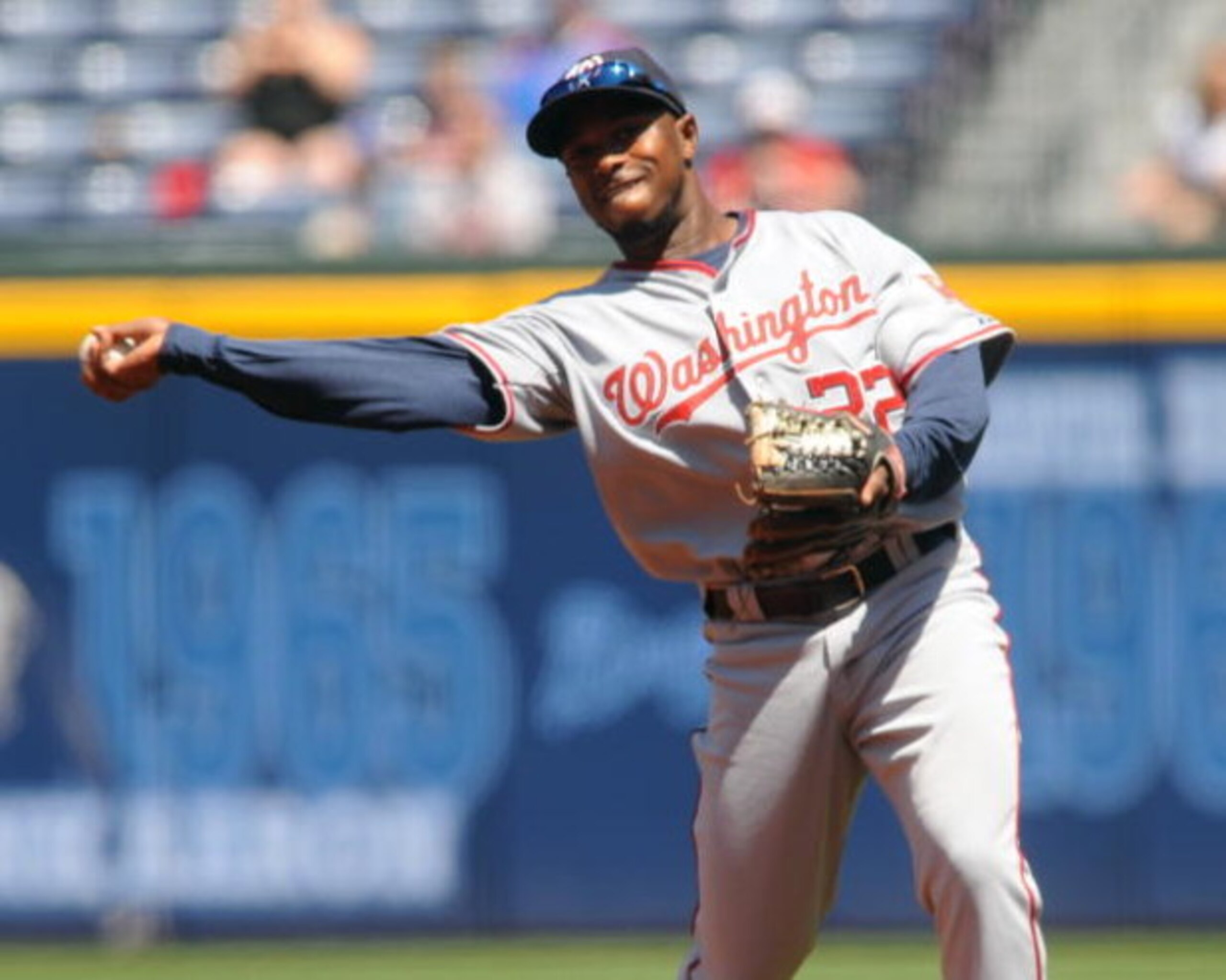 ATLANTA - APRIL 12: Infielder Willie Harris #22 of the Washington Nationals throws to first base against the Atlanta Braves April 12, 2009 at Turner Field in Atlanta, Georgia.  (Photo by Al Messerschmidt/Getty Images) 