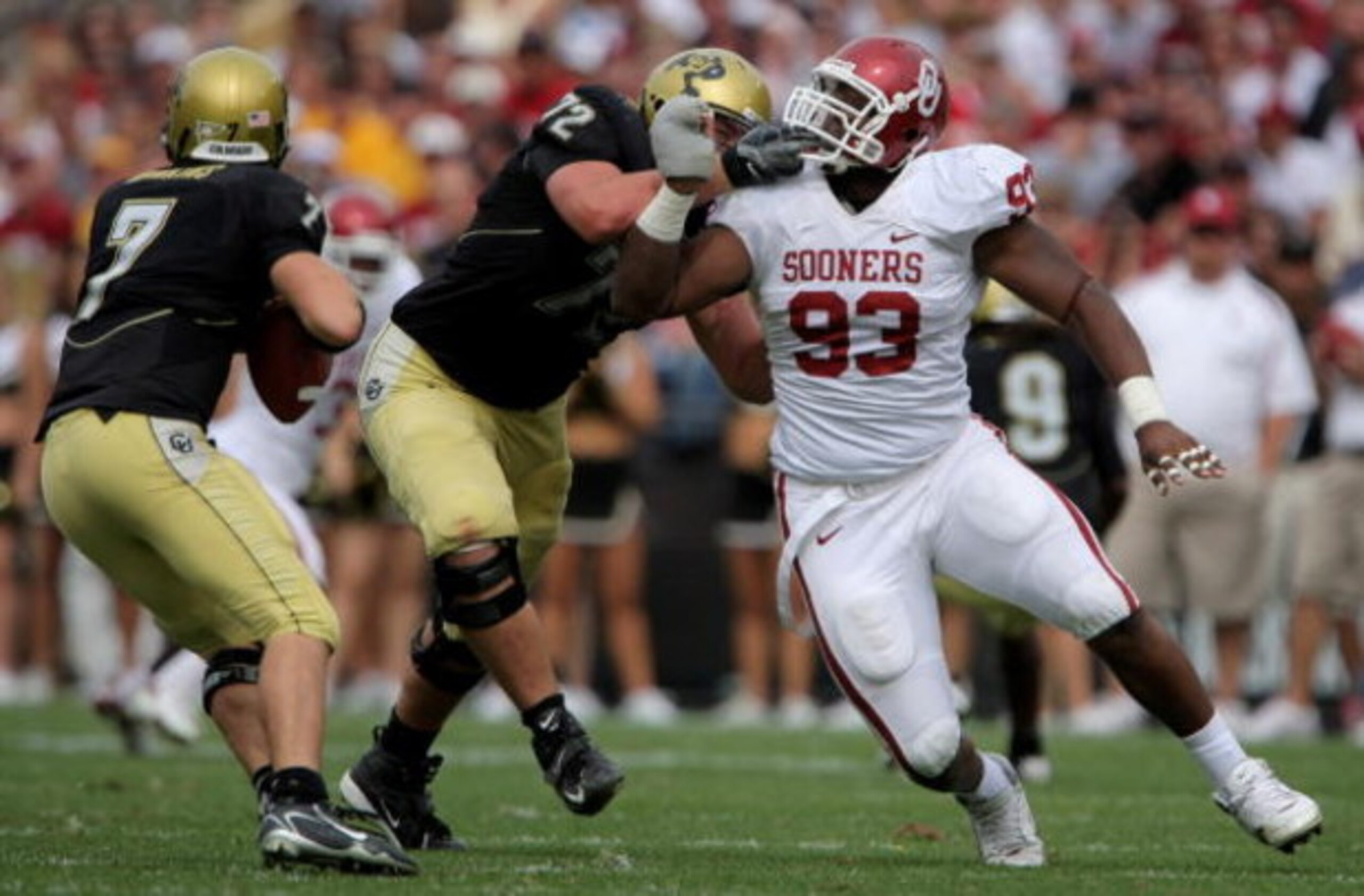 BOULDER, CO - SEPTEMBER 29:  Devin Head #93 of the Colorado Buffaloes block Gerald McCoy #93 of the Oklahoma Sooners to provide protection for quarterback Cody Hawkins #7 at Folsom Field September 29, 2007 in Boulder, Colorado. Colorado defeated Oklahoma 