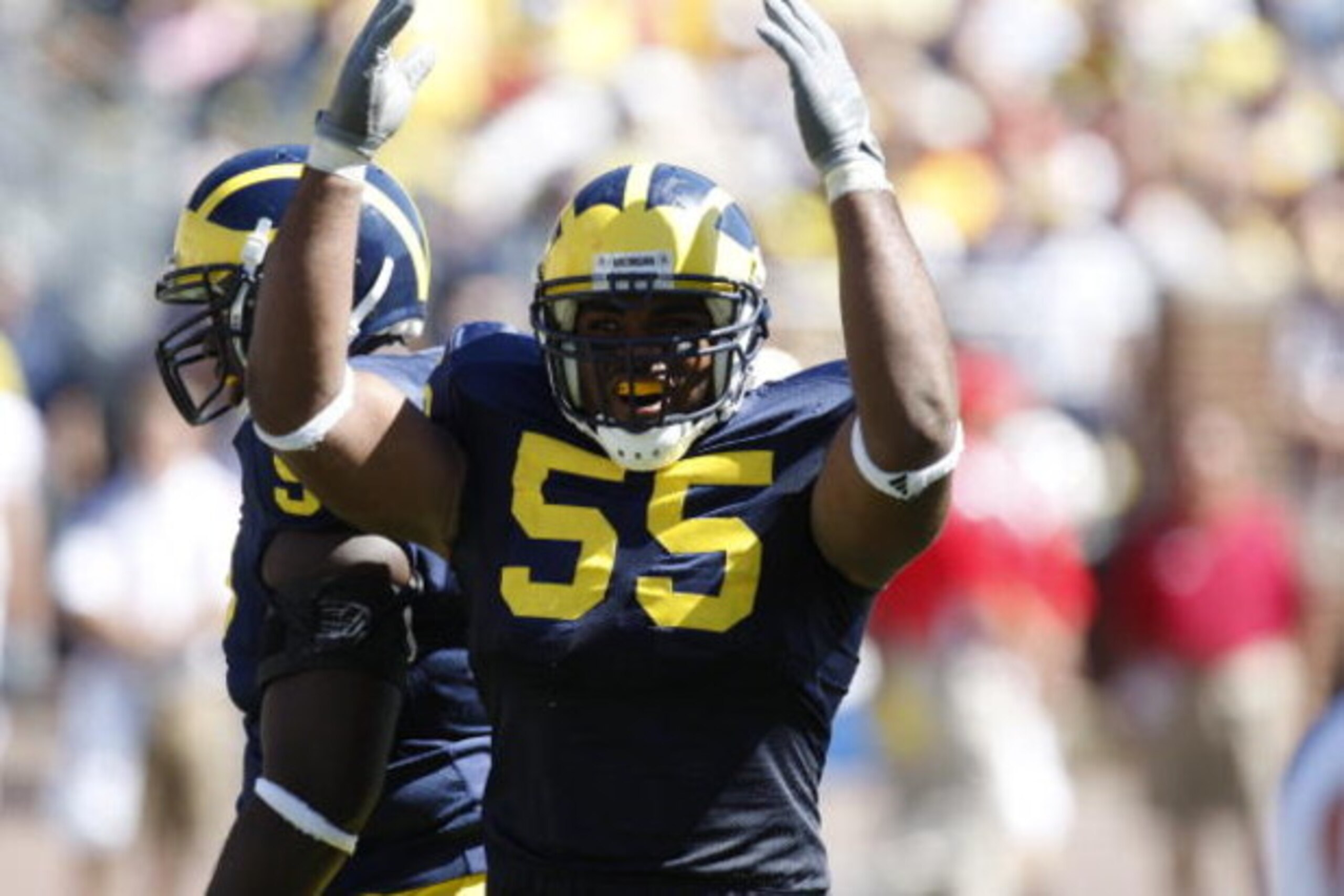 ANN ARBOR, MI - SEPTEMBER 6:  Defensive end Brandon Graham #55 of the Michigan Wolverines raises his arms during the game against the Miami of Ohio Red Hawks on September 6, 2008 at Michigan Stadium in Ann Arbor, Michigan.  The Wolverines defeated the Red