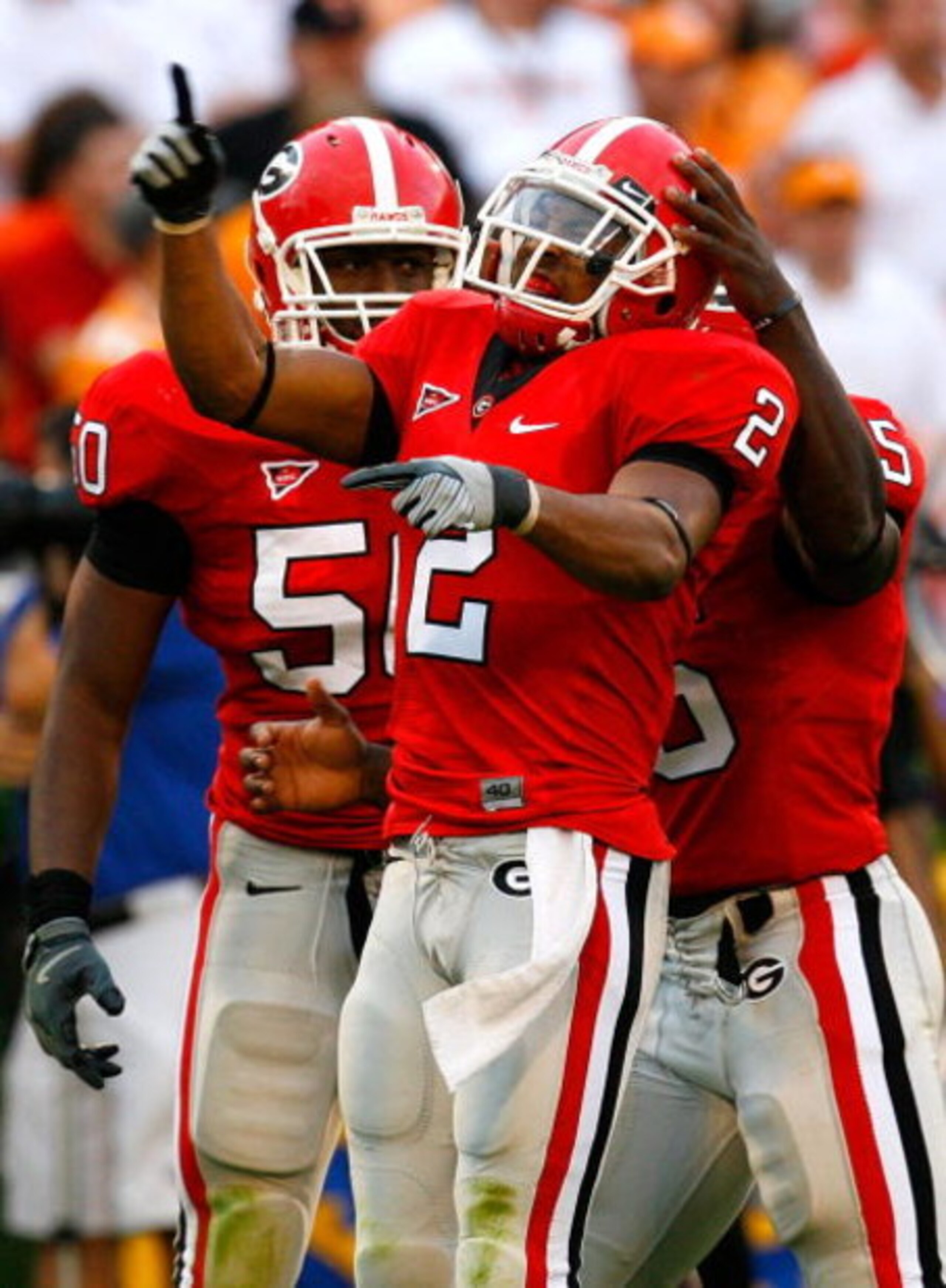 ATHENS, GA - OCTOBER 11:   Darryl Gamble #50 and Rennie Curran #35 celebrate with Asher Allen #2 of the Georgia Bulldogs after Allen's defensive stop against the Tennessee Volunteers during the game at Sanford Stadium on October 11, 2008 in Athens, Georgi
