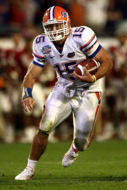 MIAMI - JANUARY 08:  Quarterback Tim Tebow #15 of the Florida Gators runs with the ball against the Oklahoma Sooners in the FedEx BCS National Championship Game at Dolphin Stadium on January 8, 2009 in Miami, Florida.  (Photo by Donald Miralle/Getty Image