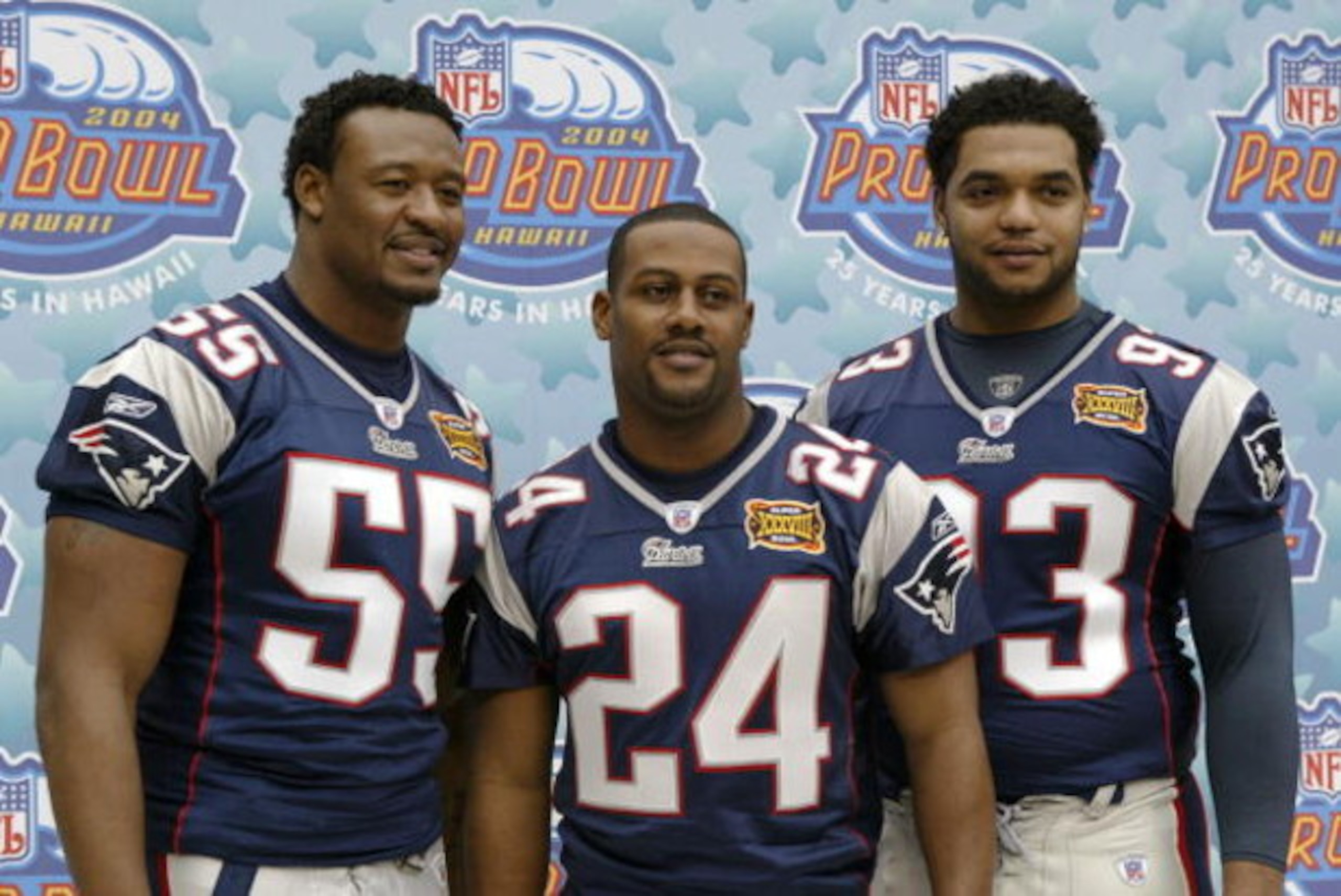 HOUSTON - JANUARY 27:  Pro Bowl selections defensive end Willie McGinest #55, cornerback Ty Law #24, defensive lineman Richard Seymour #93 of the New England Patriots pose for a photo on media day January 27, 2003 at Reliant Stadium before Super Bowl XXXV