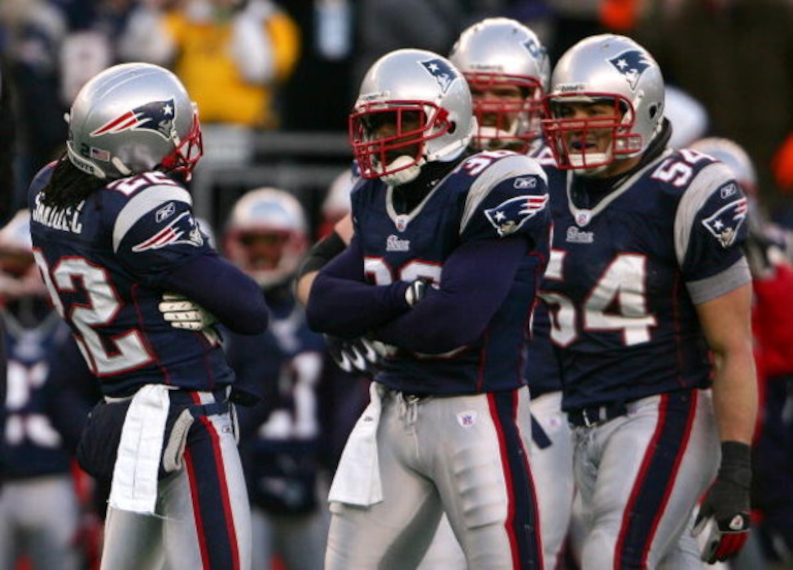 FOXBORO, MA - JANUARY 20:  (L-R) Asante Samuel #22, James Sanders #36 and Teddy Bruschi #54 of the New England Patriots react after Samuel intercepted a pass in the second quarter against the San Diego Chargers during the AFC Championship Game on January 