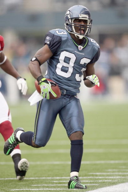 SEATTLE - NOVEMBER 16:  Deion Branch #83 of the Seattle Seahawks reacts as he runs the ball during the game against the Arizona Cardinals on November 16, 2008 at Qwest Field in Seattle, Washington. (Photo by Otto Greule Jr/Getty Images)