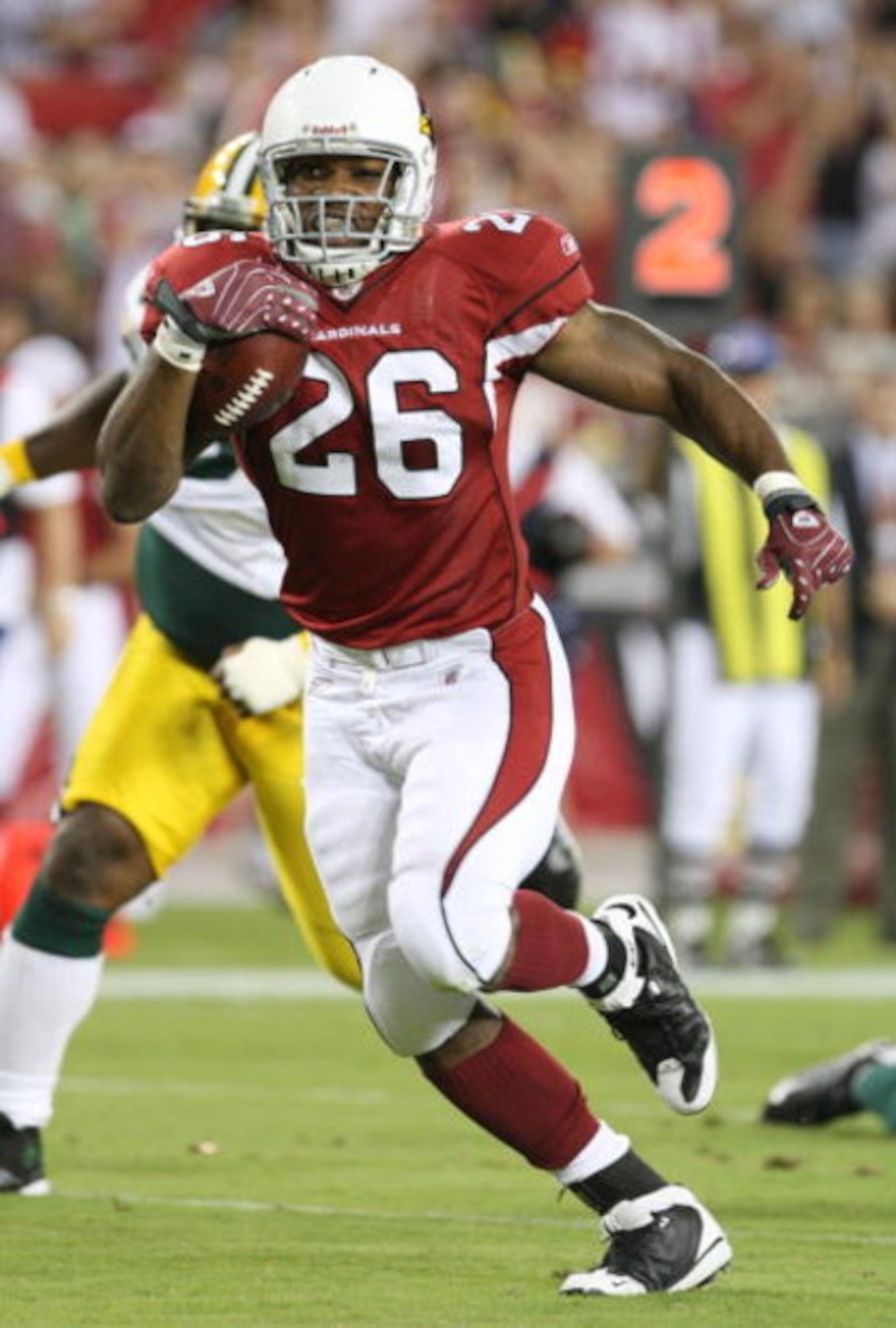 GLENDALE, AZ - AUGUST 28:  Running back Beanie Wells #26 of the Arizona Cardinals rushes for a touchdown during the second quarter against the Green Bay Packers at the University of Phoenix Stadium on August 28, 2009 in Glendale, Arizona.  (Photo by Chris