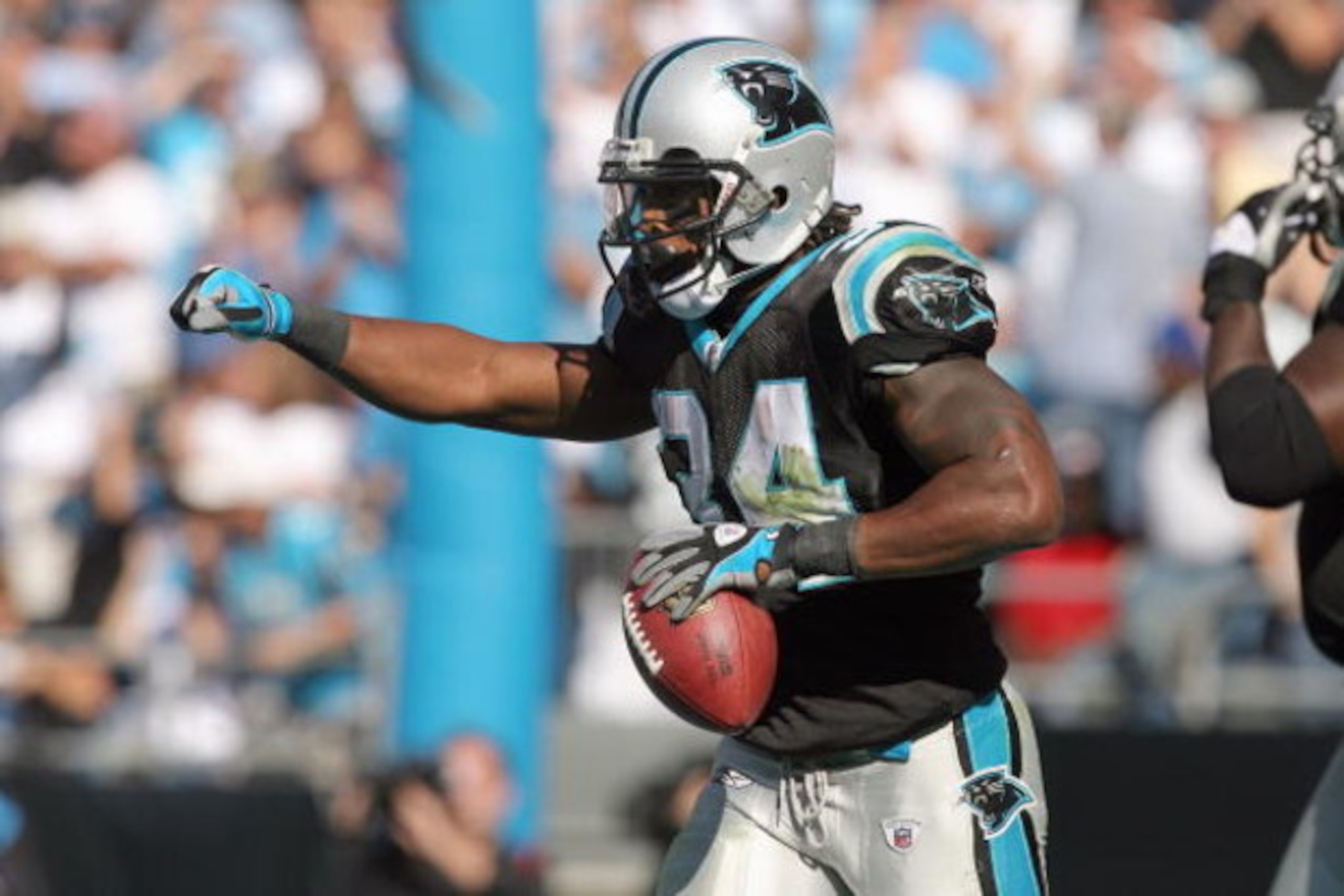 CHARLOTTE - OCTOBER 26:  DeAngelo Williams #34 of the Carolina Panthers celebrates on the field during the game against of the Arizona Cardinals at Bank of America Stadium on October 26, 2008 in Charlotte, North Carolina. (Photo by: Streeter Lecka/Getty I