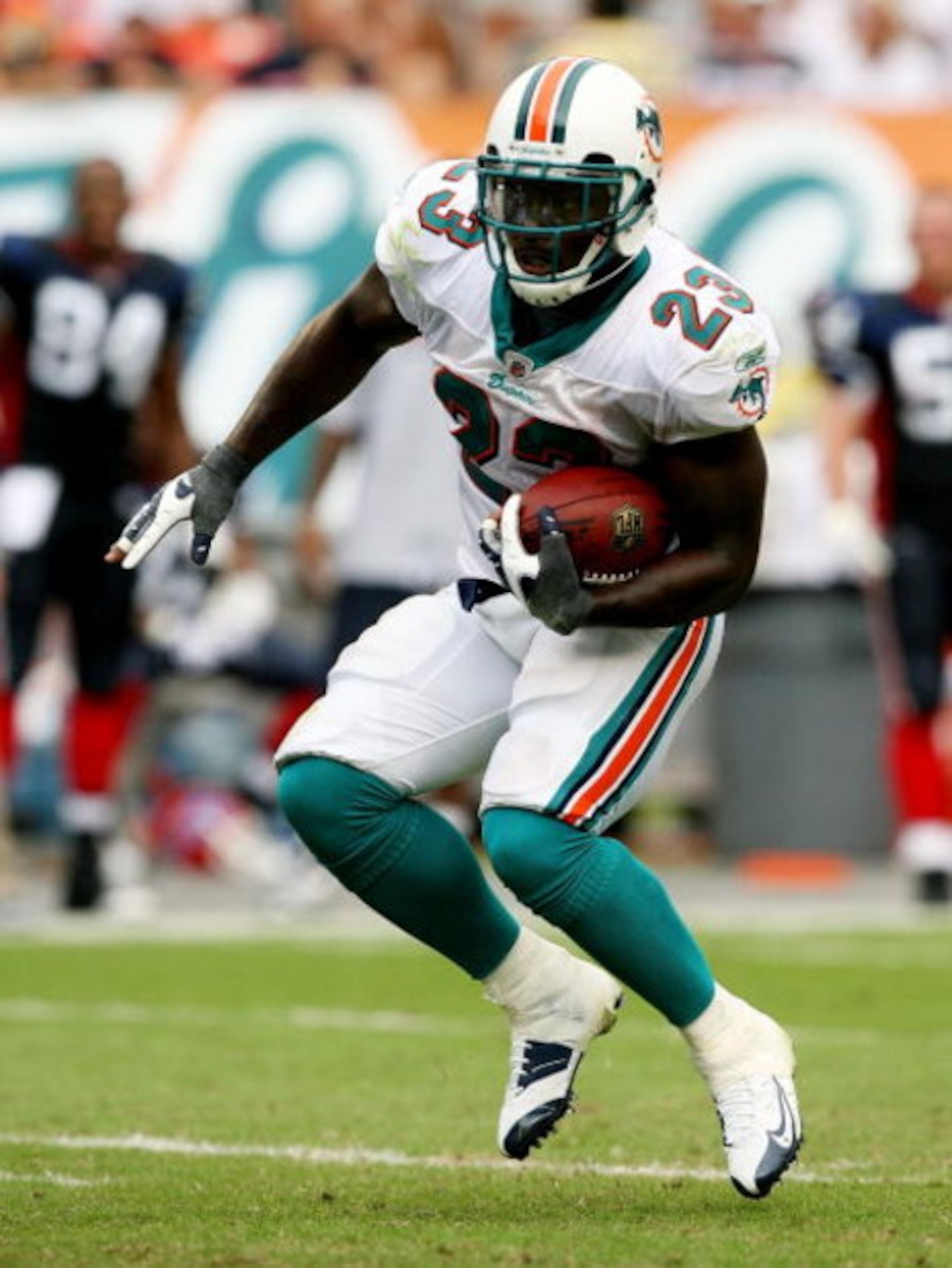 MIAMI - OCTOBER 26:  Running back Ronnie Brown #23 of the Miami Dolphins looks for room to run against the Buffalo Bills at Dolphin Stadium on October 26, 2008 in Miami, Florida. The Dolphins defeated the Bills 25-16.  (Photo by Doug Benc/Getty Images)