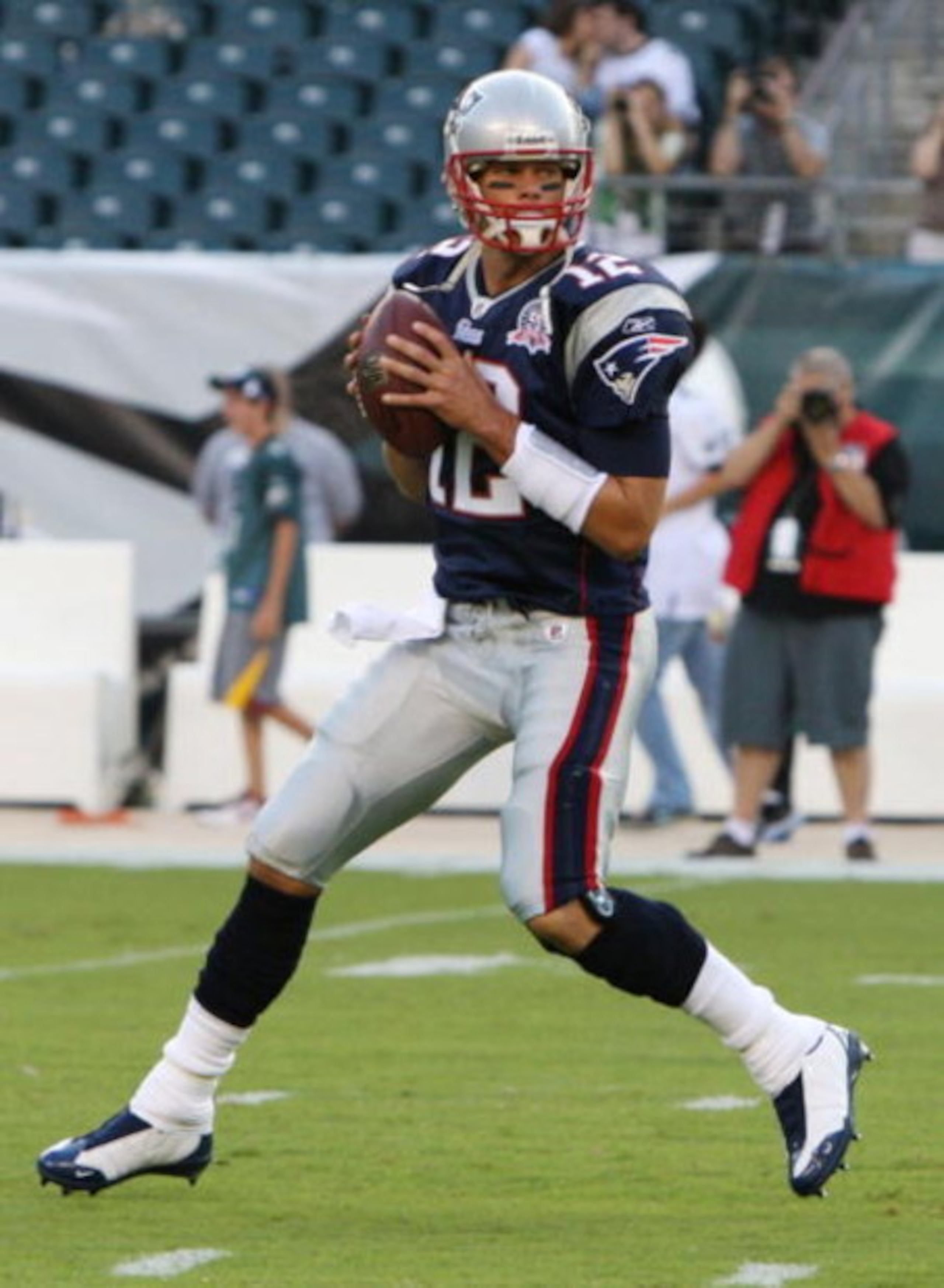 PHILADELPHIA - AUGUST 13: Quarterback Tom Brady #12 of the New England Patriots passes the ball during warmups before the preseason game against the Philadelphia Eagles on August 13, 2009 at Lincoln Financial Field in Philadelphia, Pennsylvania. (Photo by