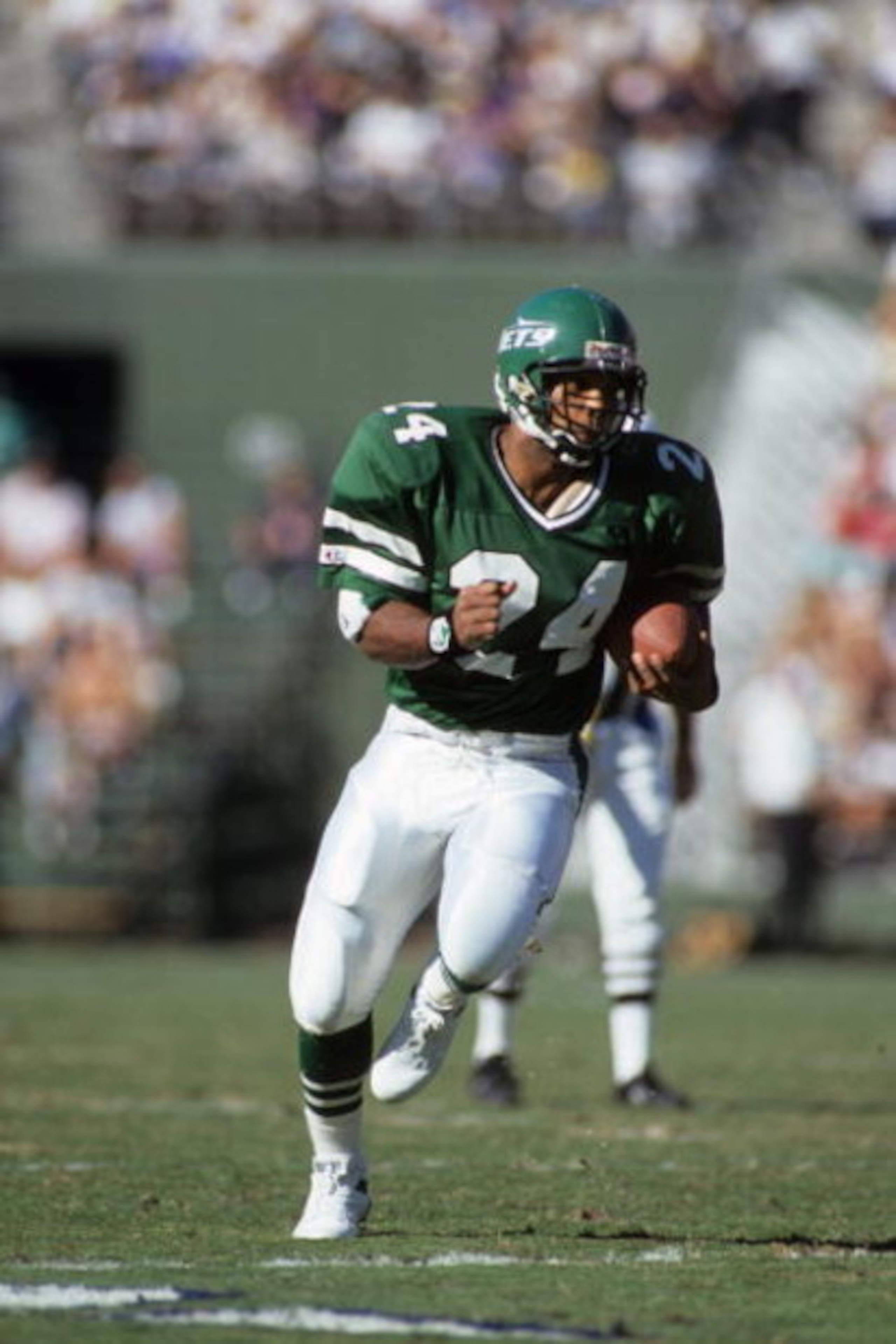 SAN DIEGO, CA - DECEMBER 2:  Running back Freeman McNeil #24 of the New York Jets runs the ball during a game against the San Diego Chargers at Jack Murphy Stadium on December 2, 1990 in San Diego, California.  The San Diego Chargers won 38-17  (Photo by 