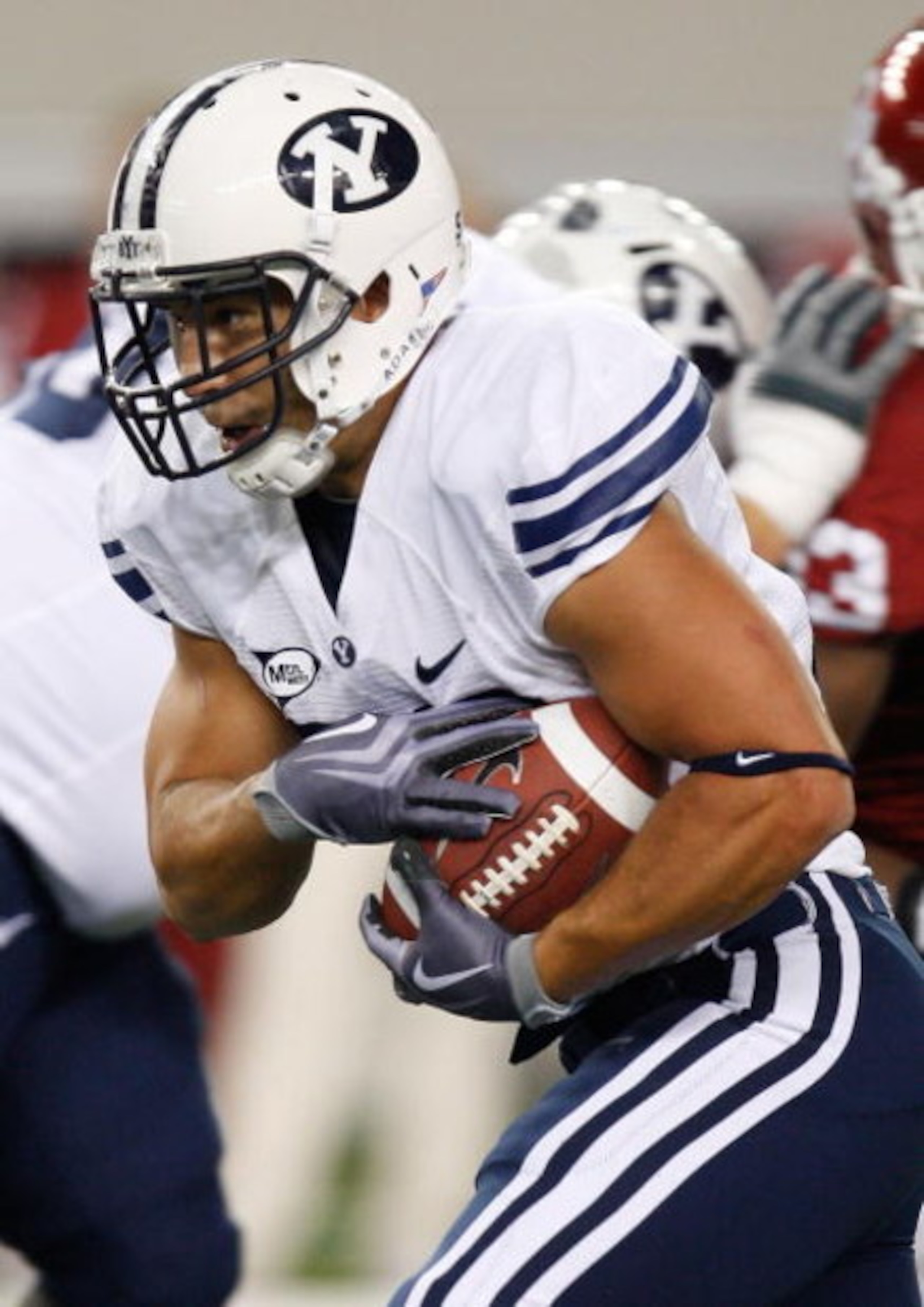 ARLINGTON, TX - SEPTEMBER 05:  Running back Bryan Kariya #33 of the Brigham Young Cougars at Cowboys Stadium on September 5, 2009 in Arlington, Texas.  (Photo by Ronald Martinez/Getty Images)