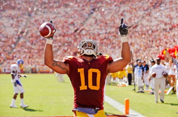 LOS ANGELES, CA - SEPTEMBER 05:  D.J. Shoemate #10 of the USC Trojans celebrates after scoring a touchdown against the San Jose State Spartans during the fourth quarter at Los Angeles Memorial Coliseum on September 5, 2009 in Los Angeles, California. USC 