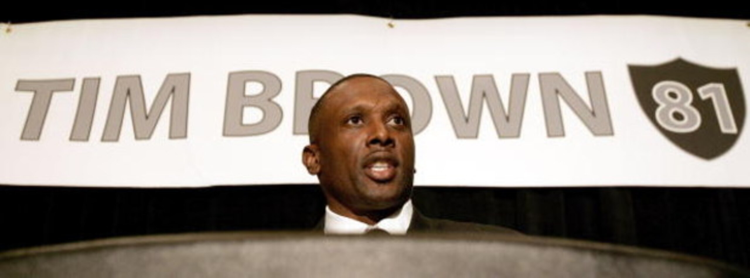 OAKLAND, CA - JULY 18: Tim Brown announces his retirement from professional football after signing a one day contract with the Oakland Raiders, whom he played most of his career with, during a press conference at the Grand Ballroom of the Oakland Airport OAKLAND, CA - JULY 18: Tim Brown announces his retirement from professional football after signing a one day contract with the Oakland Raiders, whom he played most of his career with, during a press conference at the Grand Ballroom of the Oakland Airport