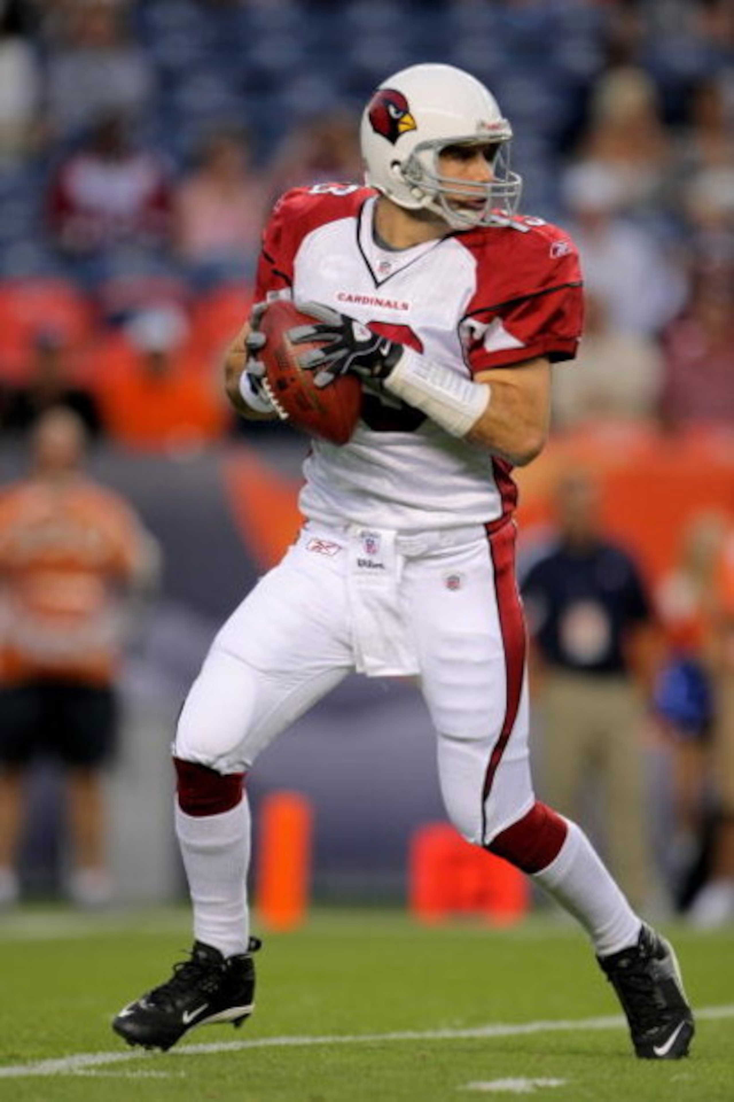 DENVER - SEPTEMBER 03: Quarterback Kurt Warner #13 of the Arizona Cardinals looks to deliver a pass against Denver Broncos during NFL preseason action at Invesco Field at Mile High on September 3, 2009 in Denver, Colorado. The Broncos defeated the Cardin DENVER - SEPTEMBER 03: Quarterback Kurt Warner #13 of the Arizona Cardinals looks to deliver a pass against Denver Broncos during NFL preseason action at Invesco Field at Mile High on September 3, 2009 in Denver, Colorado. The Broncos defeated the Cardin
