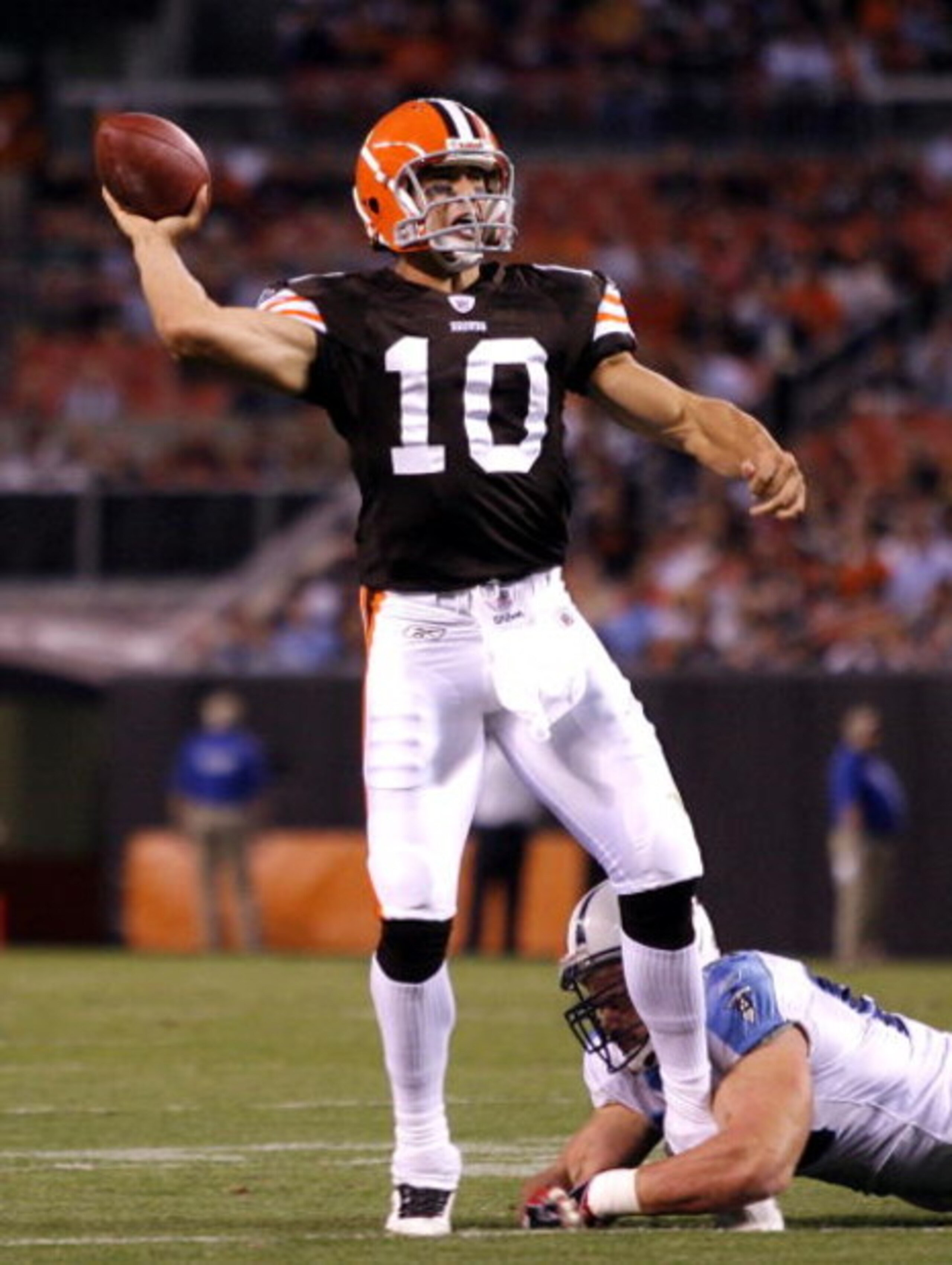 CLEVELAND - AUGUST 29: Brady Quinn #10 of the Cleveland Browns throws to a reciever as he is hit by Kyle Vanden Bosch #93 of the Tennessee Titans at Cleveland Browns Stadium on August 29, 2009 in Cleveland, Ohio. (Photo by Matt Sullivan/Getty Images) CLEVELAND - AUGUST 29: Brady Quinn #10 of the Cleveland Browns throws to a reciever as he is hit by Kyle Vanden Bosch #93 of the Tennessee Titans at Cleveland Browns Stadium on August 29, 2009 in Cleveland, Ohio. (Photo by Matt Sullivan/Getty Images)