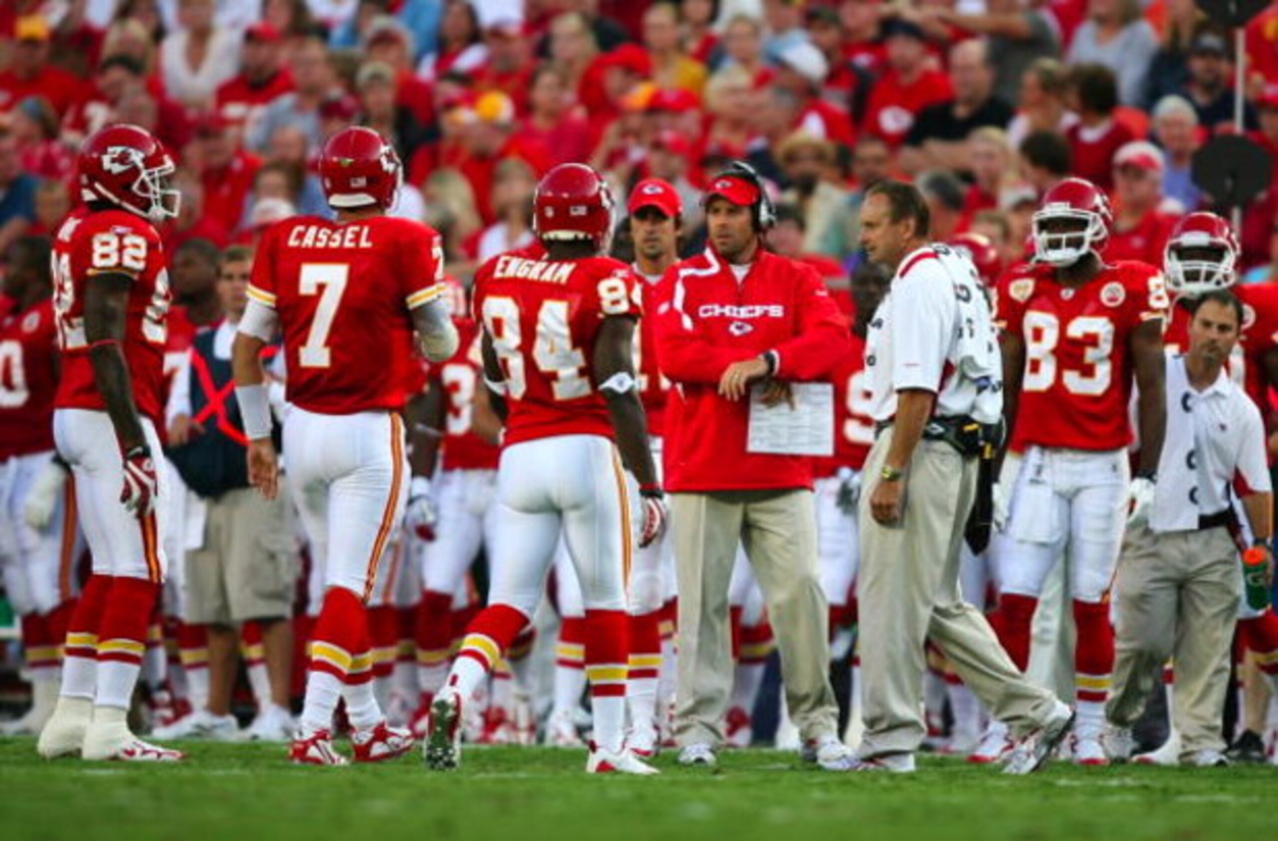 KANSAS CITY, MO - AUGUST 29: Quaterback Matt Cassel #7 of the Kansas City Chiefs walks with teammates Dwayne Bowe #82 and Bobby Engram #84 to the sidelines towards head coach Todd Haley (C)  after Cassell appeared to hurt his left leg against the Seattle 