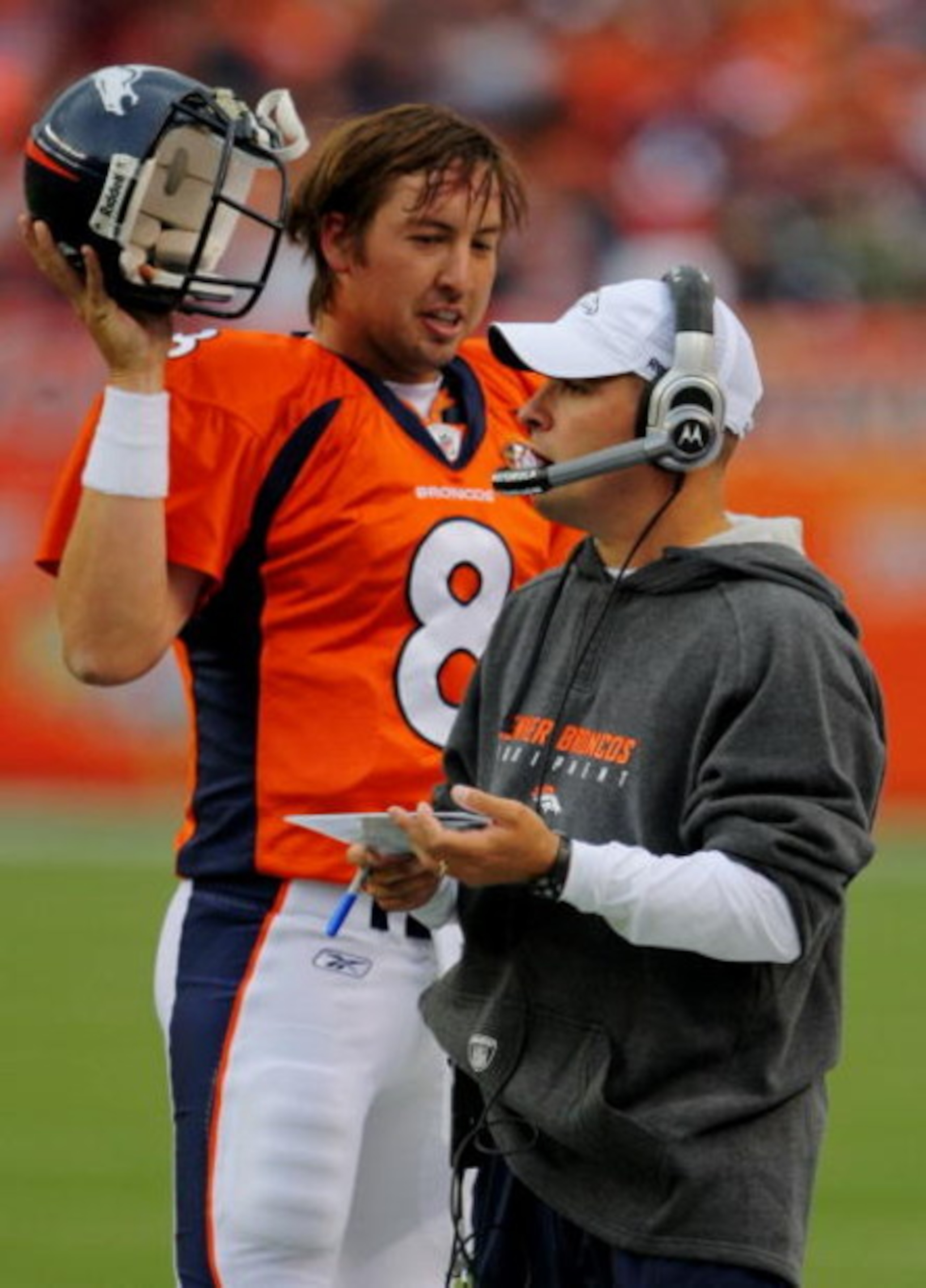 DENVER - AUGUST 30:  Head Coach Josh McDaniels (L) of the Denver Broncos talks to his quarterback Kyle Orton #8 (R) during the preseason game against the Chicago Bears at INVESCO Field at Mile High on August 30, 2009 in Denver, Colorado.  (Photo by Doug P