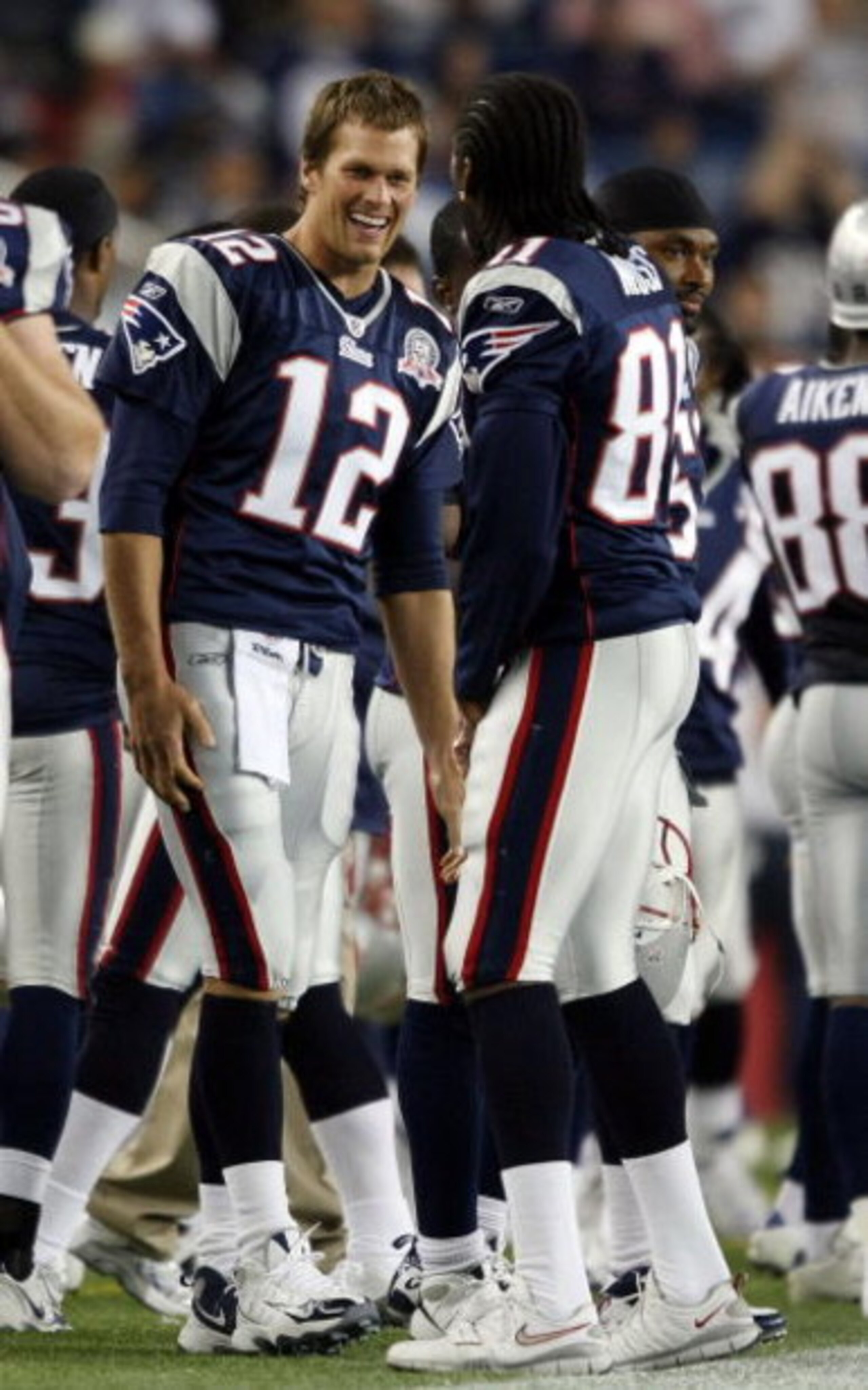 FOXBORO, MA - SEPTEMBER 03:  Tom Brady #12 of the New England Patriots and Randy Moss #81 celebrate in the fourth quarter against the New York Giants on September 3, 2009 at Gillette Stadium in Foxboro, Massachusetts. The Patriots defeated the Giants 38-2