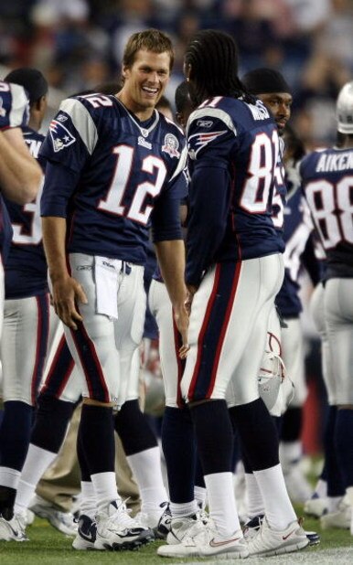 FOXBORO, MA - SEPTEMBER 03:  Tom Brady #12 of the New England Patriots and Randy Moss #81 celebrate in the fourth quarter against the New York Giants on September 3, 2009 at Gillette Stadium in Foxboro, Massachusetts. The Patriots defeated the Giants 38-2