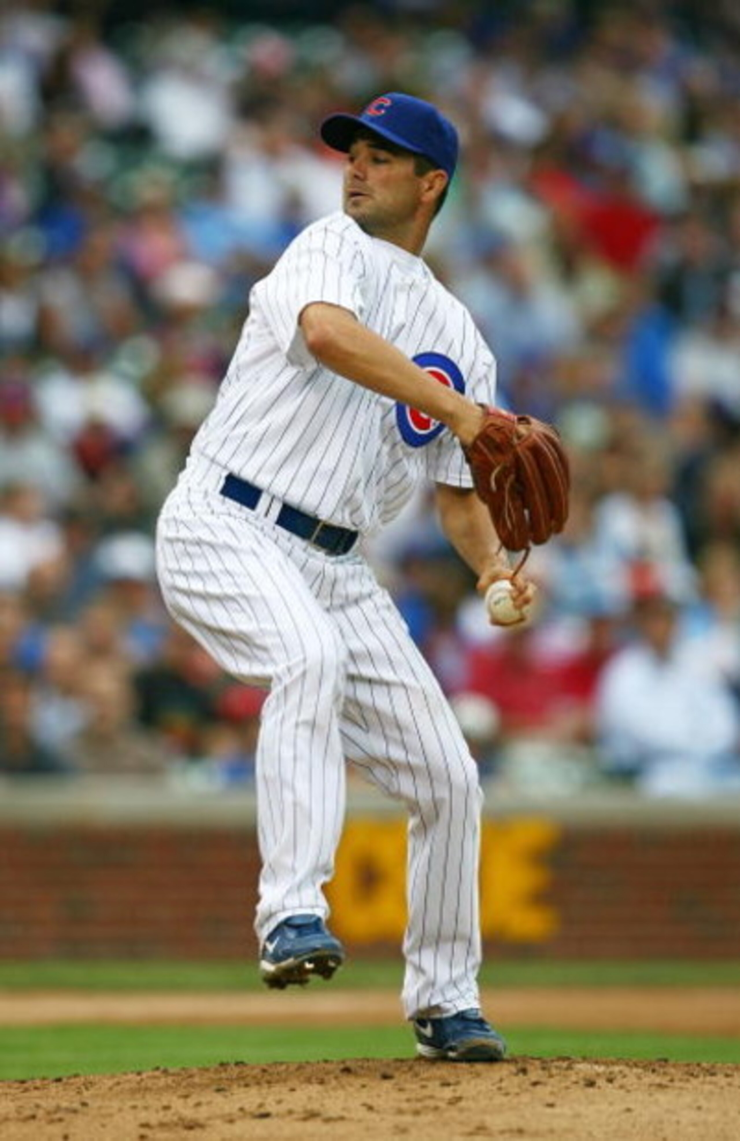 CHICAGO - AUGUST 28: Starting pitcher Ted Lilly #30 of the Chicago Cubs delivers the ball against the New York Mets on August 28, 2009 at Wrigley Field in Chicago, Illinois. The Cubs defeated the Mets 5-2.  (Photo by Jonathan Daniel/Getty Images)