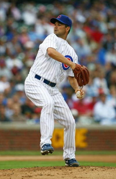 CHICAGO - AUGUST 28: Starting pitcher Ted Lilly #30 of the Chicago Cubs delivers the ball against the New York Mets on August 28, 2009 at Wrigley Field in Chicago, Illinois. The Cubs defeated the Mets 5-2.  (Photo by Jonathan Daniel/Getty Images)