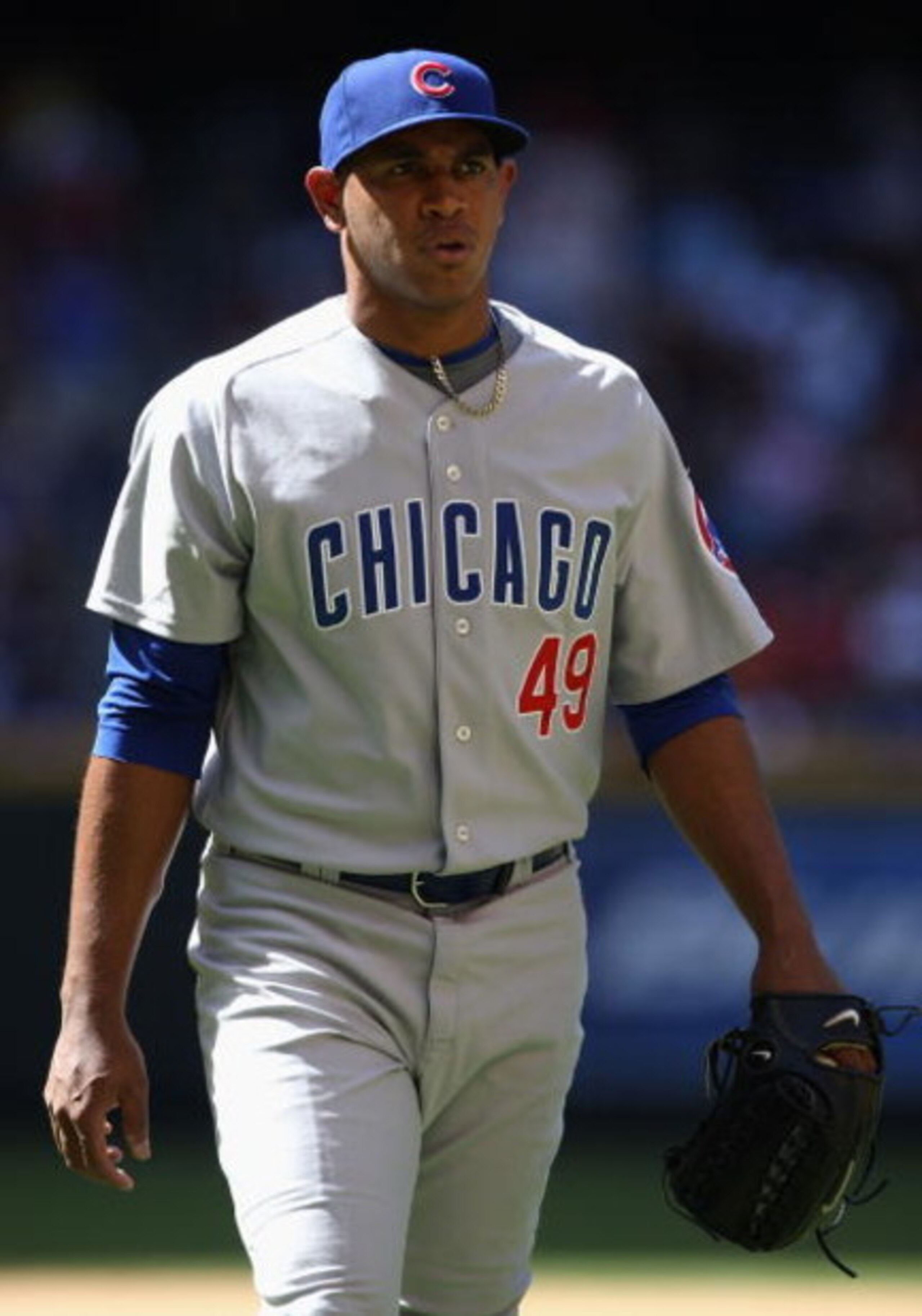 PHOENIX - APRIL 29:  Relief pitcher Carlos Marmol #49 of the Chicago Cubs walks back to the dugout after being removed from the game against the Arizona Diamondbacks at Chase Field on April 29, 2009 in Phoenix, Arizona. The Diamondbacks defeated the Cubs 