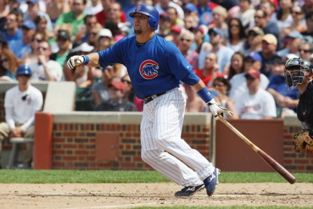 CHICAGO - JULY 03:  Jake Fox #5 of the Chicago Cubs at bat against the Milwaukee Brewers during their MLB game on July 3, 2009 at Wrigley Field in Chicago, Illinois. (Photo by Jonathan Daniel/Getty Images) 