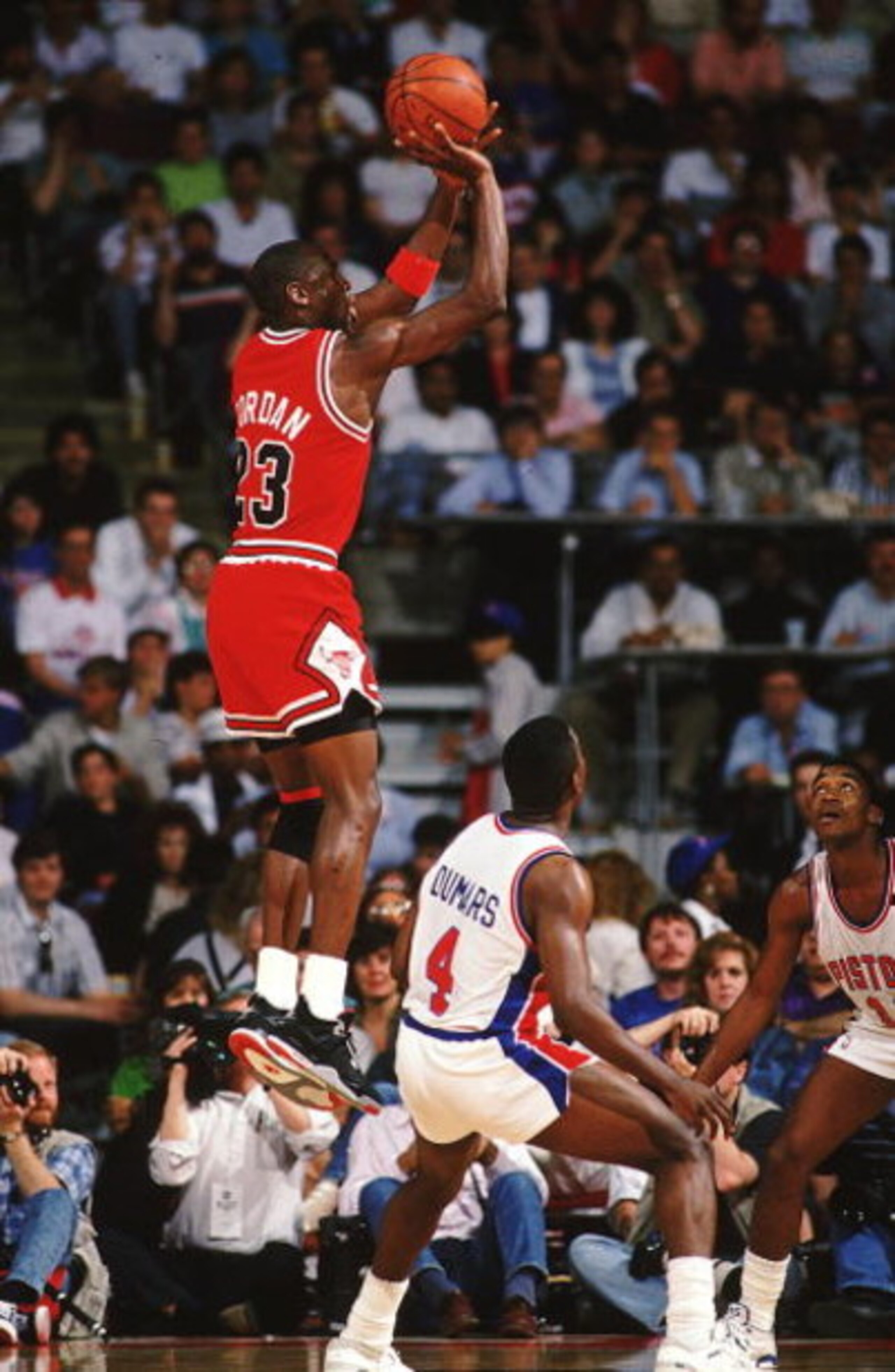 1988:  Michael Jordan #23 of the Chicago Bulls jumps to shoot the ball during a game against the Detroit Pistons. NOTE TO USER: It is expressly understood that the only rights Allsport are offering to license in this Photograph are one-time, non-exclusive