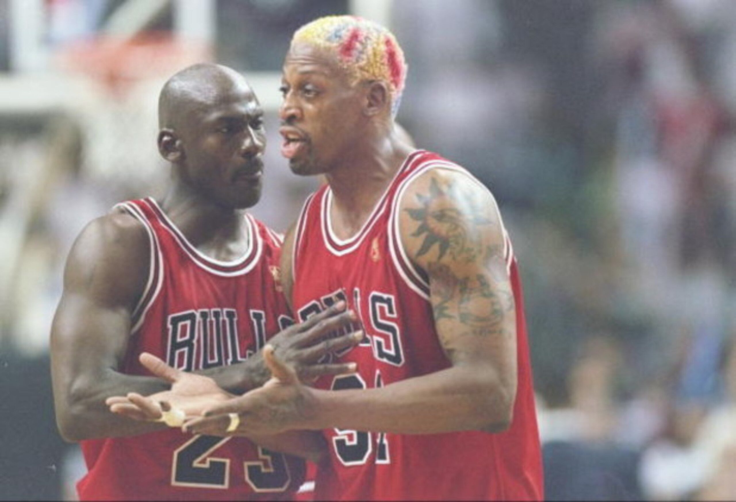 26 May 1997:  Guard Michael Jordan holds back forward Dennis Rodman of the Chicago Bulls as he argues with an official during a playoff game against the Miami Heat at the Miami Arean in Miami, Florida.  The Heat won the game 87-80. Mandatory Credit: Andy 
