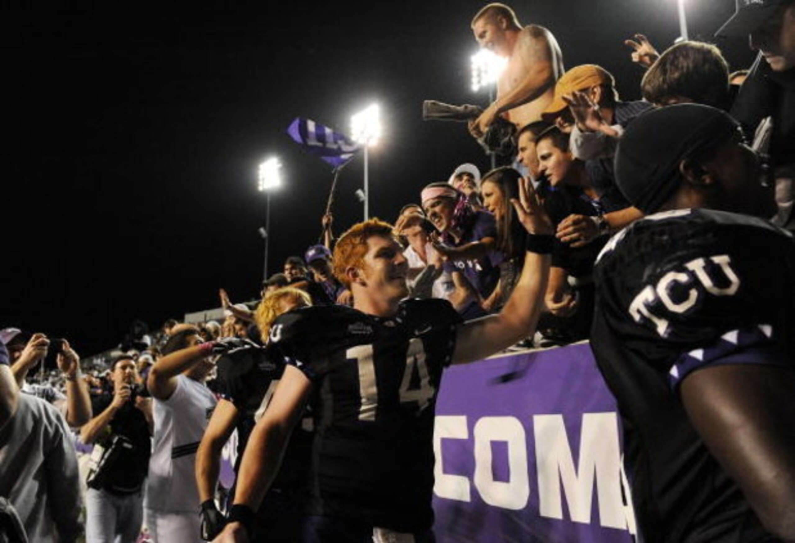 FORT WORTH, TX - OCTOBER 16:  Quarterback Andy Dalton #14 of the TCU Horned Frogs celebrates a 32-7 win against the BYU Cougars at Amon G. Carter Stadium on October 16, 2008 in Fort Worth, Texas.  (Photo by Ronald Martinez/Getty Images)