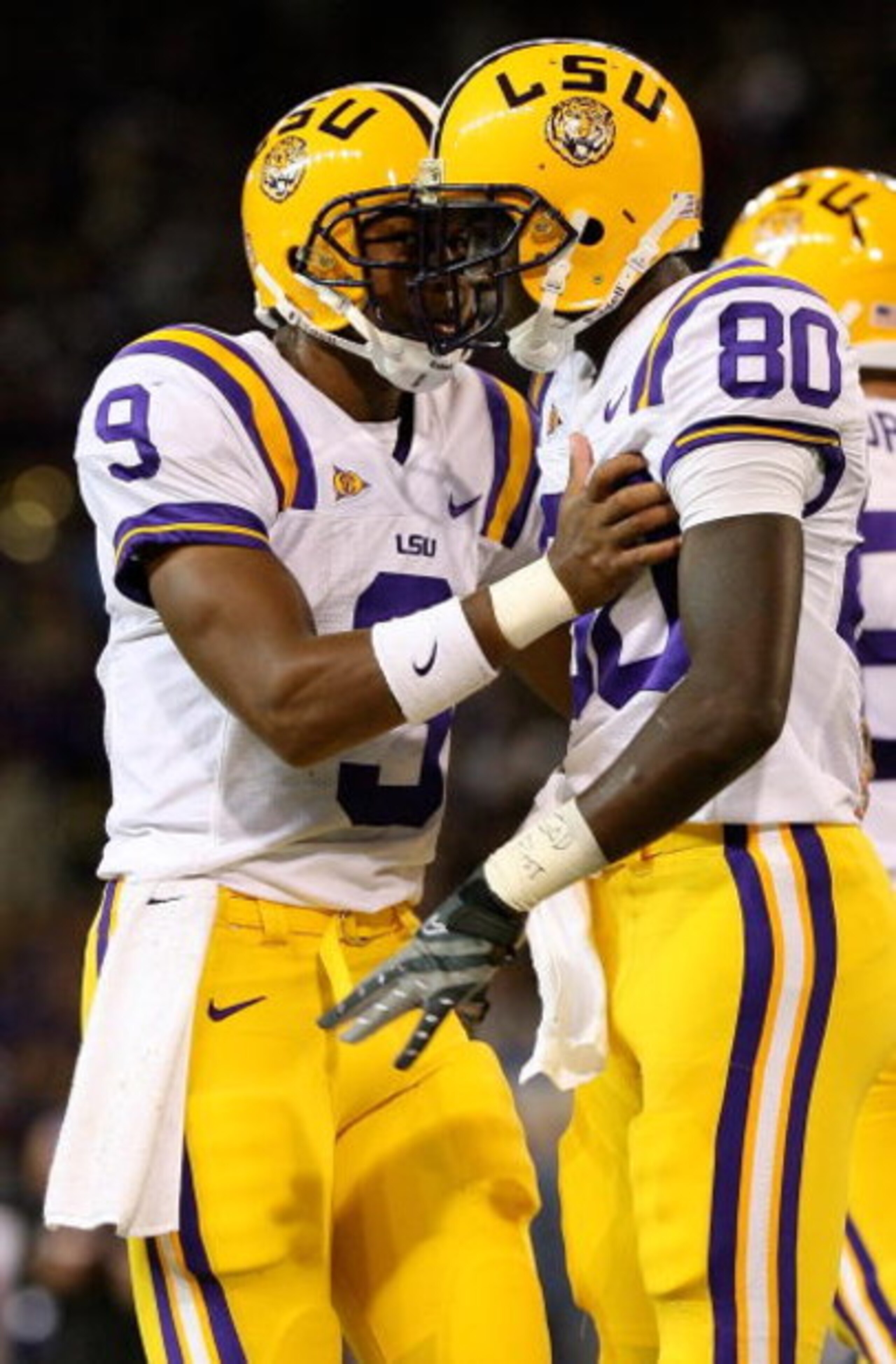 SEATTLE - SEPTEMBER 05:  Wide receiver Terrance Toliver #80 of the LSU Tigers celebrates with quarterback Jordan Jefferson #9 after scoring a touchdown in the third quarter against the Washington Huskies on September 5, 2009 at Husky Stadium in Seattle, W