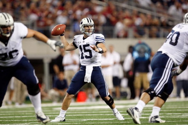 ARLINGTON, TX - SEPTEMBER 05:  Quarterback Max Hall #15 of the Brigham Young Cougars drops back to pass against the Oklahoma Sooners at Cowboys Stadium on September 5, 2009 in Arlington, Texas.  (Photo by Ronald Martinez/Getty Images)