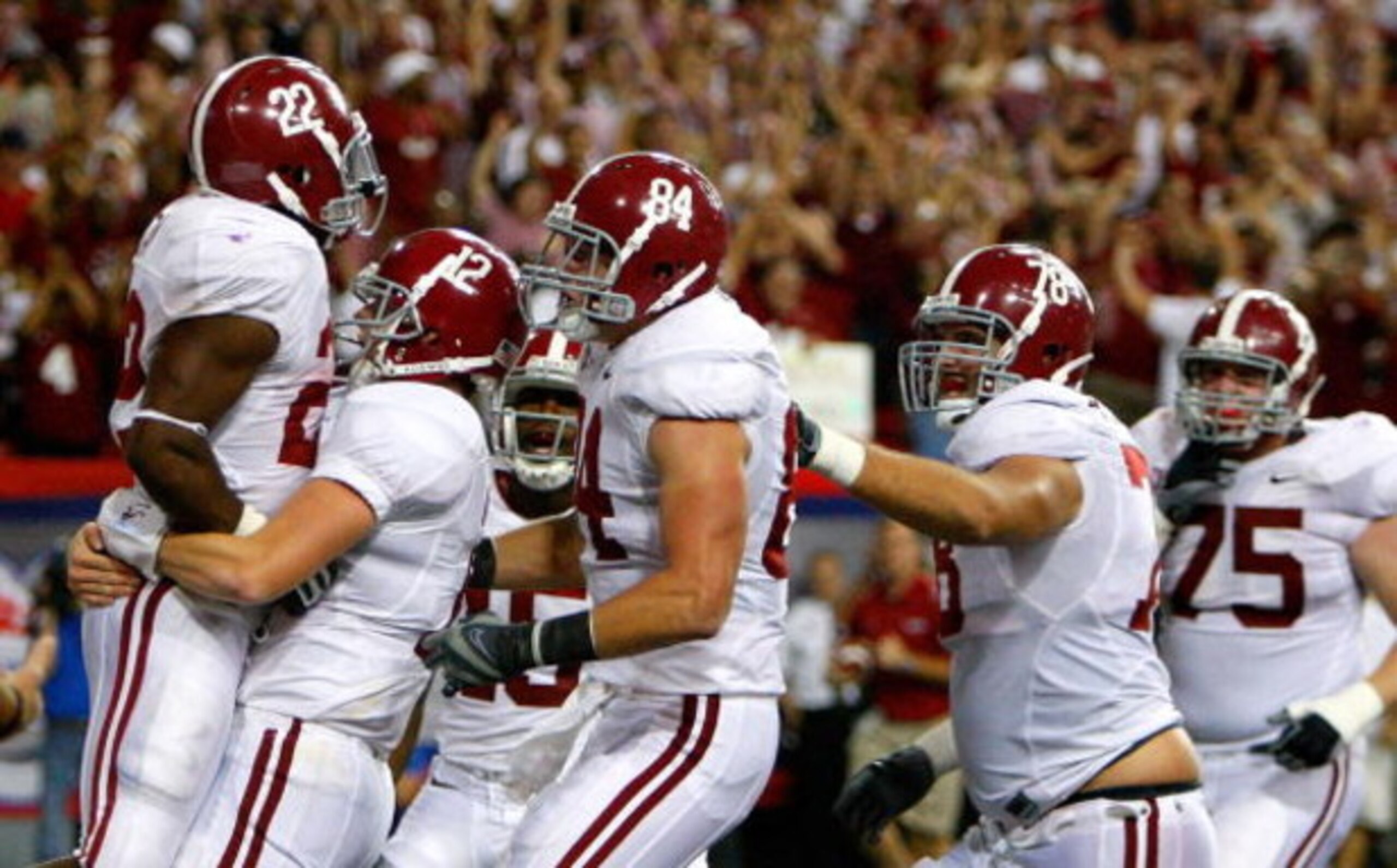 ATLANTA - SEPTEMBER 05:  Running back Mark Ingram #22 of the Alabama Crimson Tide celebrates his touchdown with quarterback Greg McElroy #12 against the Virginia Tech Hokies during the Chick-fil-A Kickoff Game at Georgia Dome on September 5, 2009 in Atlan