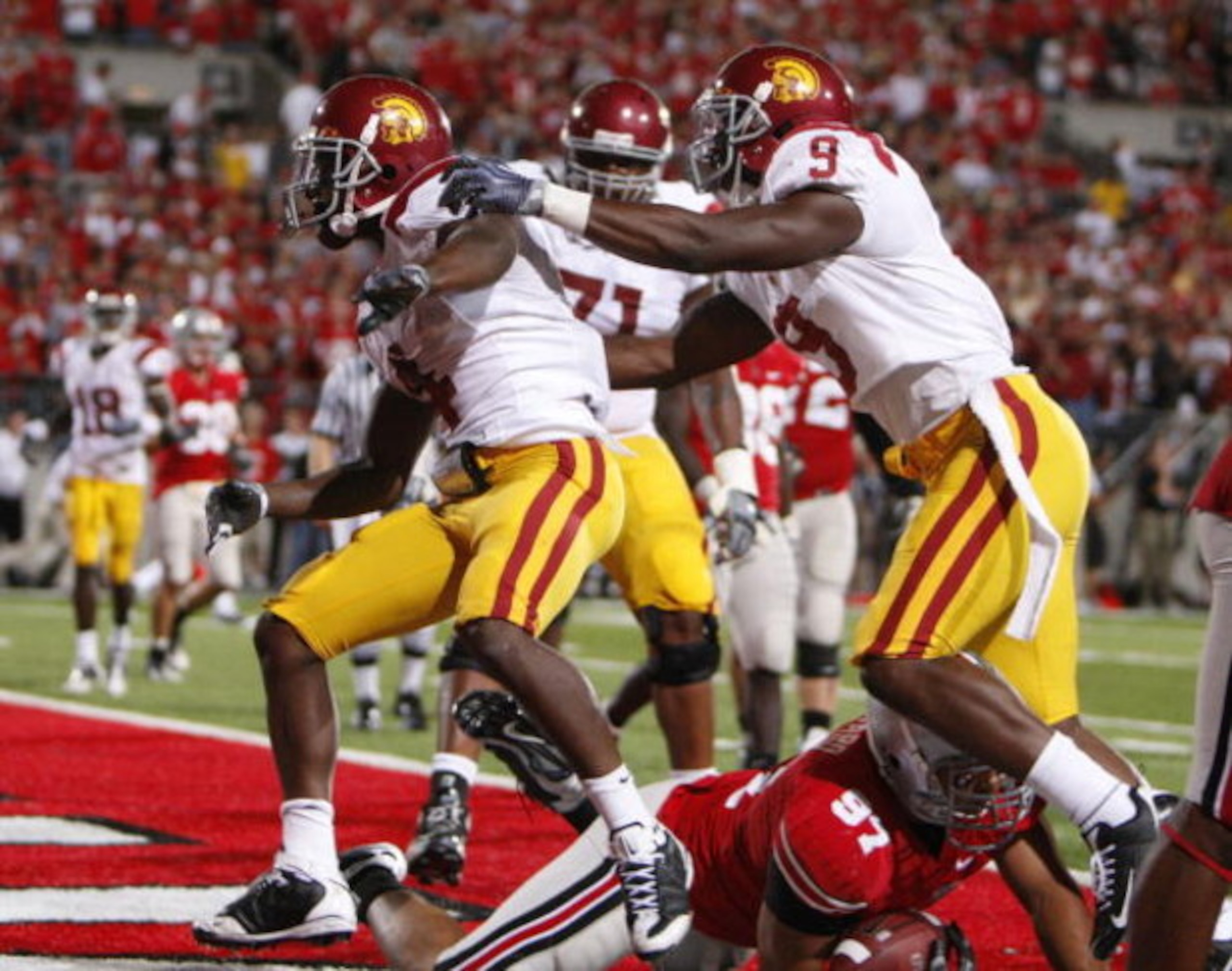 COLUMBUS, OH - SEPTEMBER 13: Joe McKnight #4 of the Southern California Trojans celebrates a two point conversion with David Ausberry #9 while playing the Ohio State Buckeyes on September 13, 2009 at Ohio Stadium in Columbus, Ohio.  (Photo by Gregory Sham