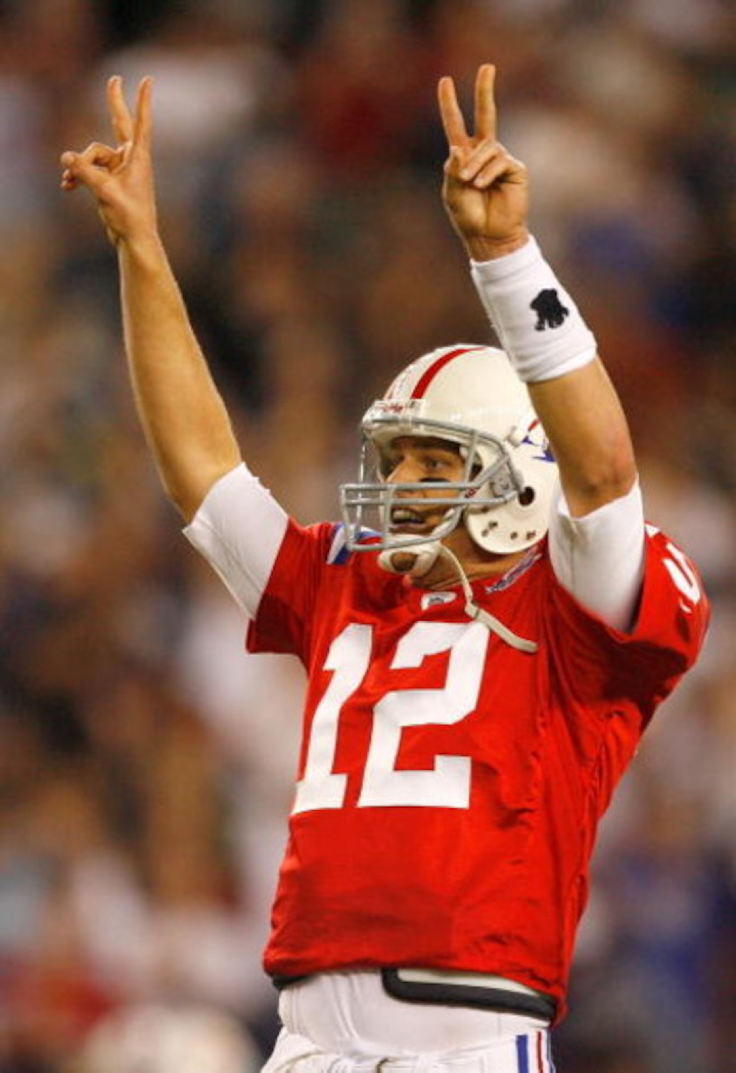 FOXBORO, MA - SEPTEMBER 14:  Tom Brady #12 of the New England Patriots signals that he will attempt a two-point conversion after touchdown in the fourth quarter against the Buffalo Bills in the fourth quarter at Gillette Stadium on September 14, 2009 in F
