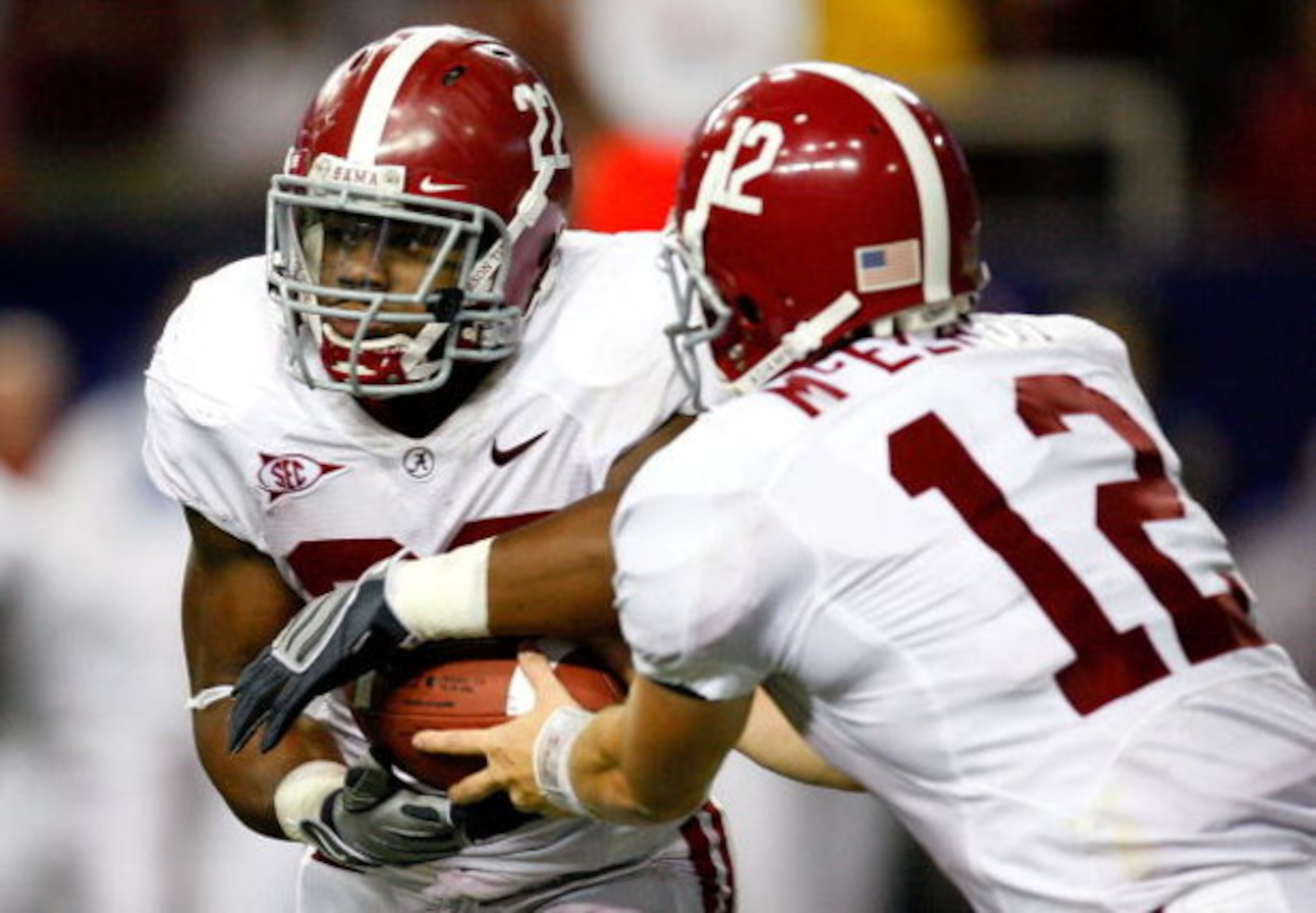 ATLANTA - SEPTEMBER 05: Running back Mark Ingram #22 of the Alabama Crimson Tide takes a handoff from quarterback Greg McElroy #12 against the Virginia Tech Hokies during the Chick-fil-A Kickoff Game at Georgia Dome on September 5, 2009 in Atlanta, Georg ATLANTA - SEPTEMBER 05: Running back Mark Ingram #22 of the Alabama Crimson Tide takes a handoff from quarterback Greg McElroy #12 against the Virginia Tech Hokies during the Chick-fil-A Kickoff Game at Georgia Dome on September 5, 2009 in Atlanta, Georg