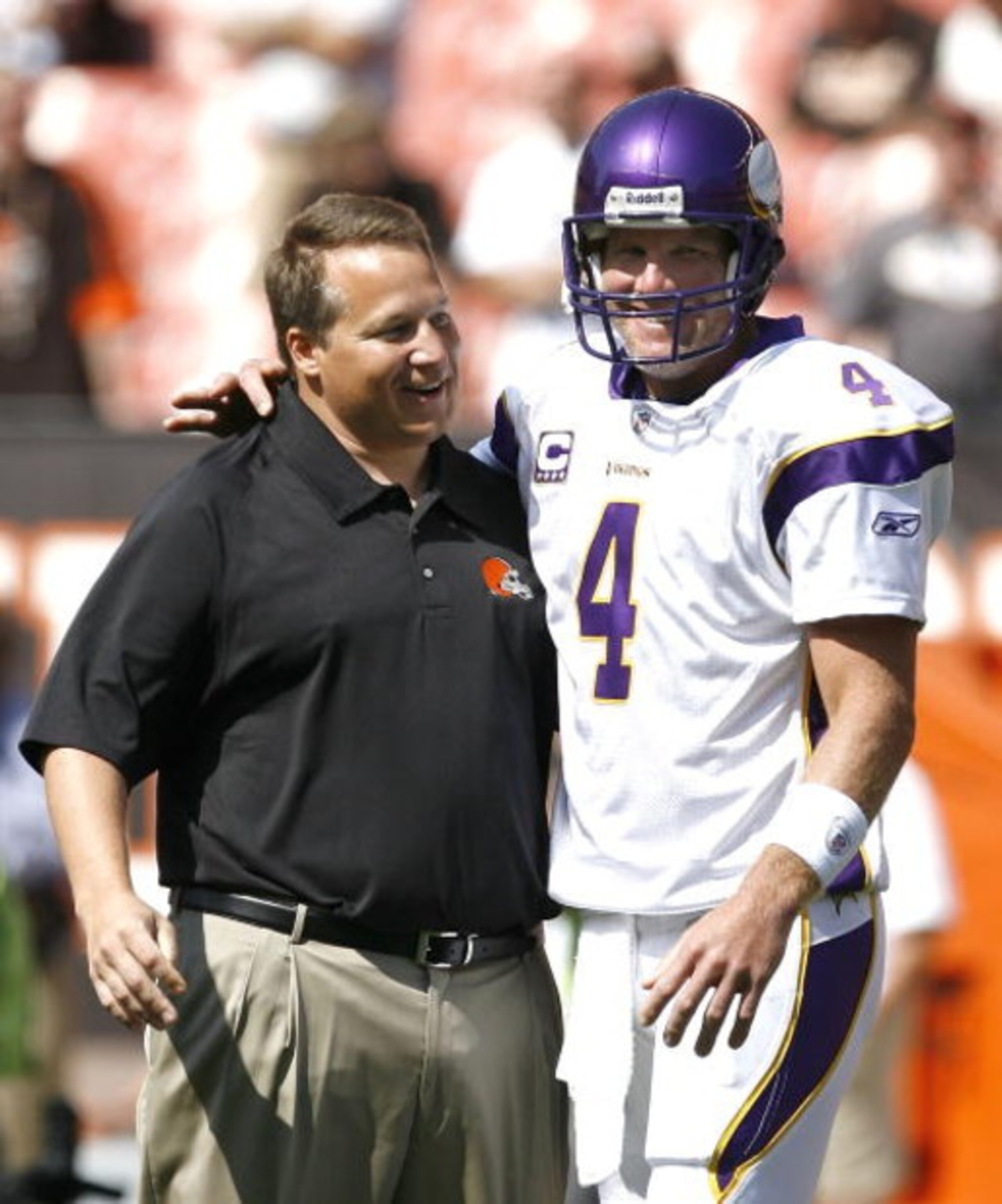 CLEVELAND - SEPTEMBER 13:  Brett Farve #4 of the Minnesota Vikings hugs Eric Mangini head coach of the Cleveland Browns prior to their game against the Cleveland Browns at Cleveland Browns Stadium on September 13, 2009 in Cleveland, Ohio.  (Photo by Matt 