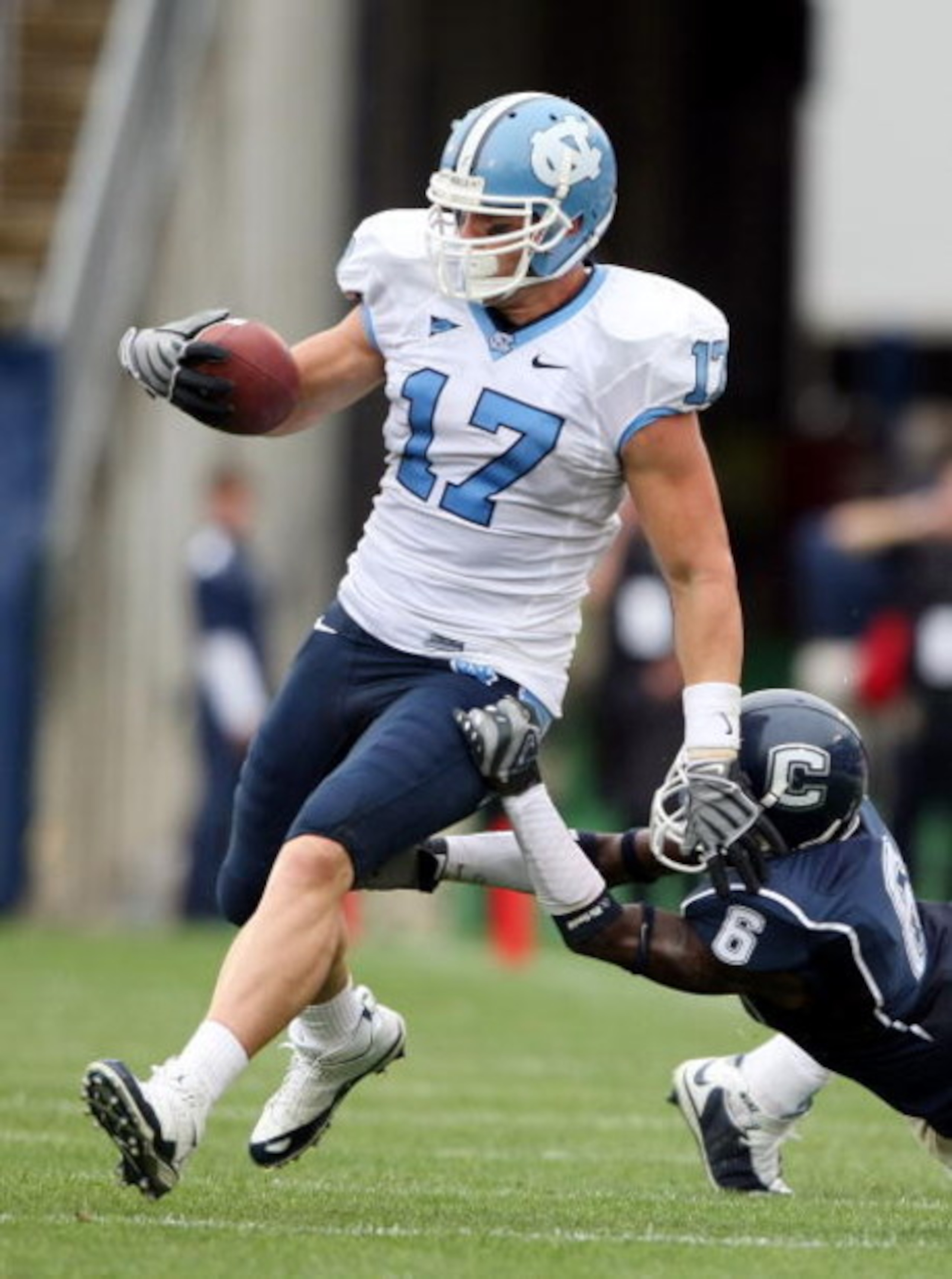 EAST HARTFORD, CT - SEPTEMBER 12:  Zack Pianalto #17 of the North Carolinia Tar Heels carries the ball as Jasper Howard #6 of the Connecticut Huskies makes the tackle on September 12, 2009 at Rentschler Field in East Hartford, Connecticut. The Tar Heels d