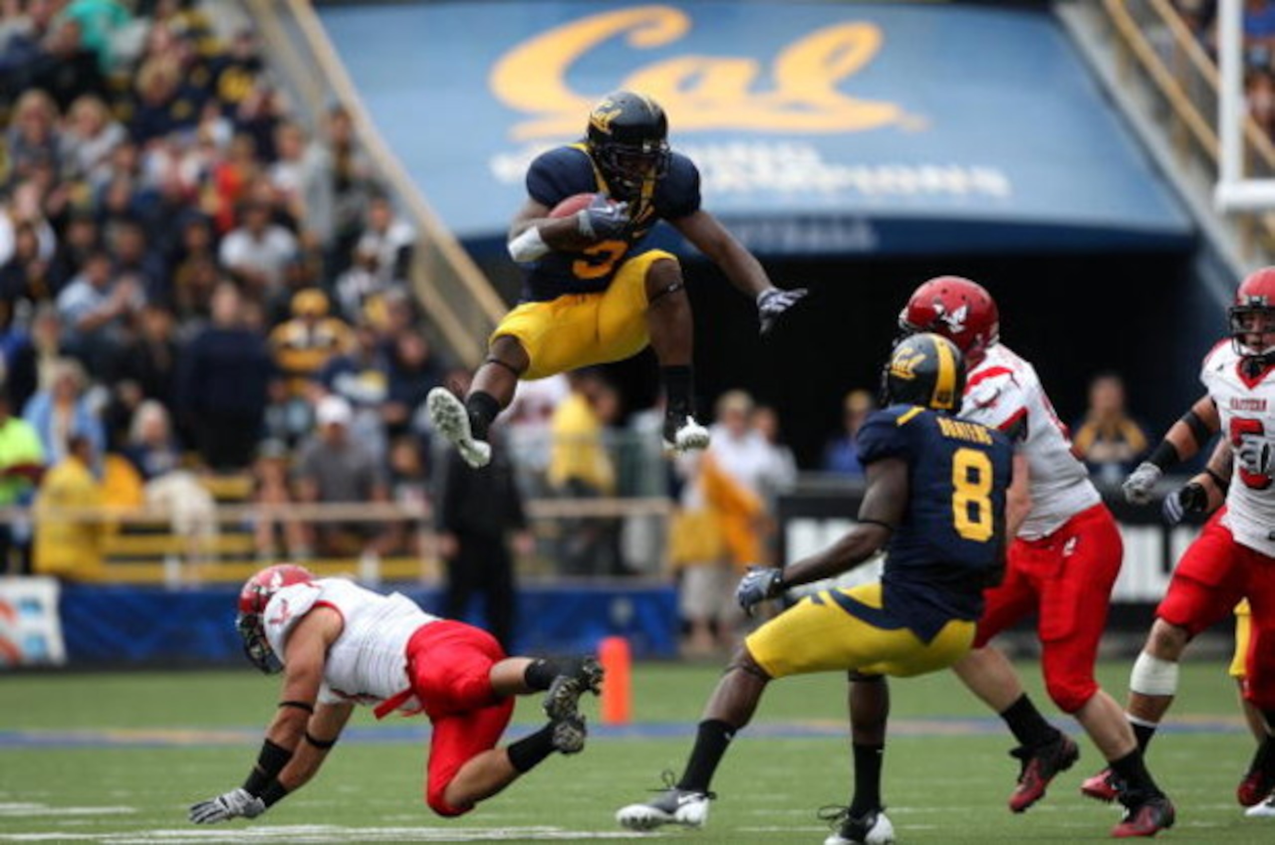 BERKELEY, CA - SEPTEMBER 12:  Jeremy Ross #3 of the California Golden Bears jumps over Kyle Wilkins #7 of the Eastern Washington Eagles on a punt return at Memorial Stadium on September 12, 2009 in Berkeley, California.  (Photo by Jed Jacobsohn/Getty Imag