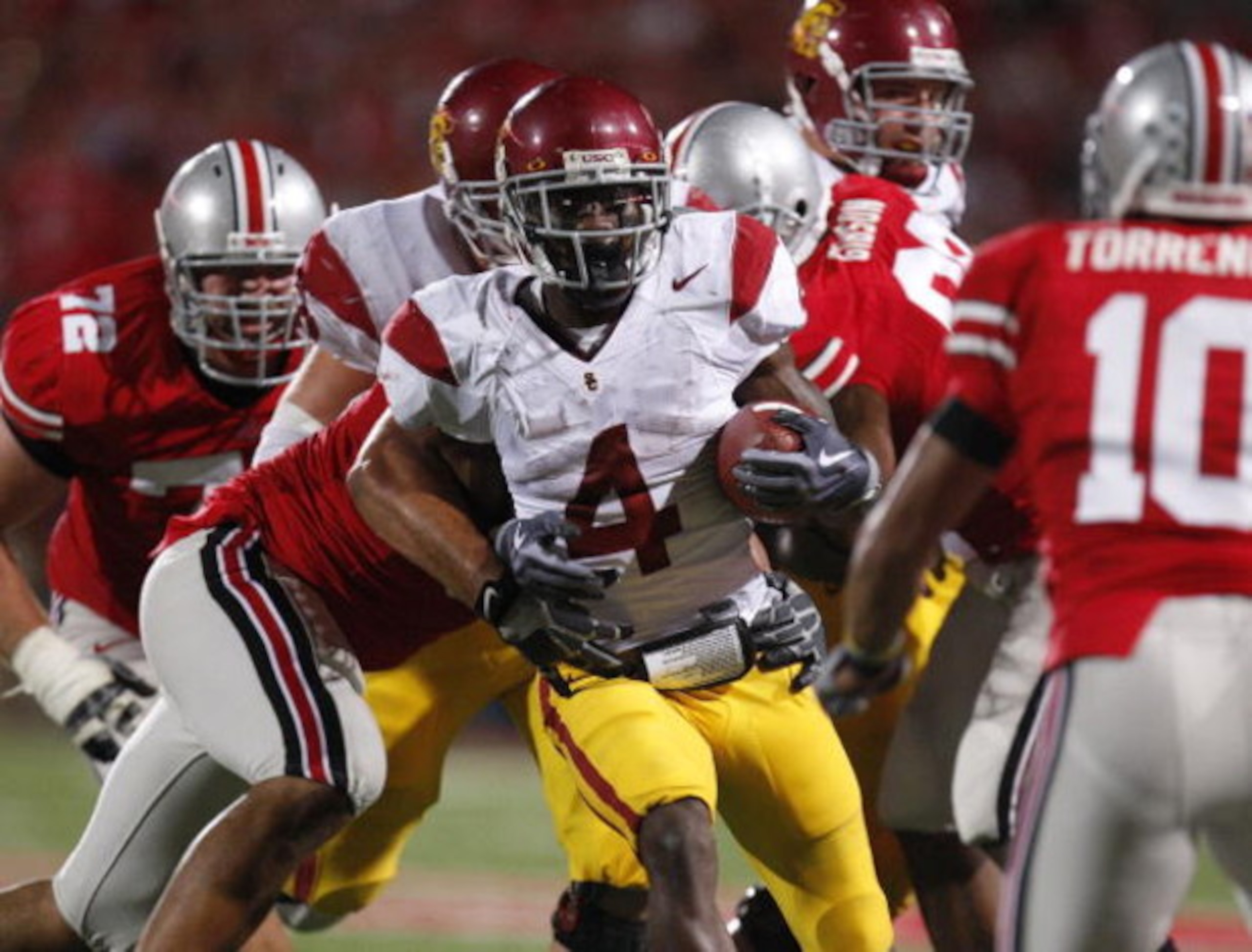 COLUMBUS, OH - SEPTEMBER 13:  Joe McKnight #4 of the Southern California Trojans looks for running room while playing the Ohio State Buckeyes on September 13, 2009 at Ohio Stadium in Columbus, Ohio. USC won the game 18-15. (Photo by Gregory Shamus/Getty I