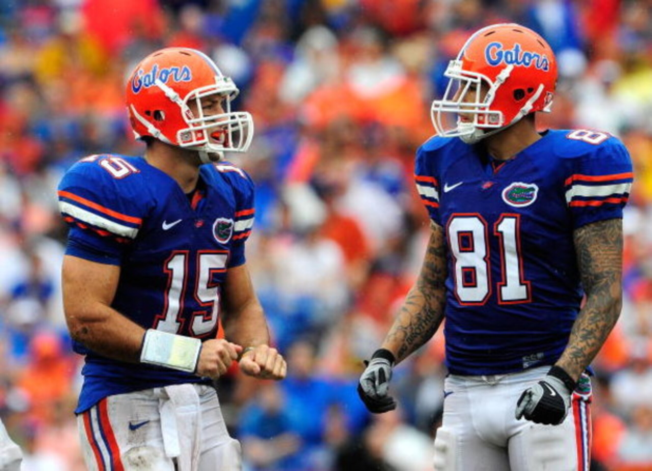 GAINESVILLE, FL - SEPTEMBER 12:  Tim Tebow #15 of the Florida Gators speaks with Aaron Hernandez #81 during the game against the Troy Trojans  at Ben Hill Griffin Stadium on September 12, 2009 in Gainesville, Florida.  (Photo by Sam Greenwood/Getty Images