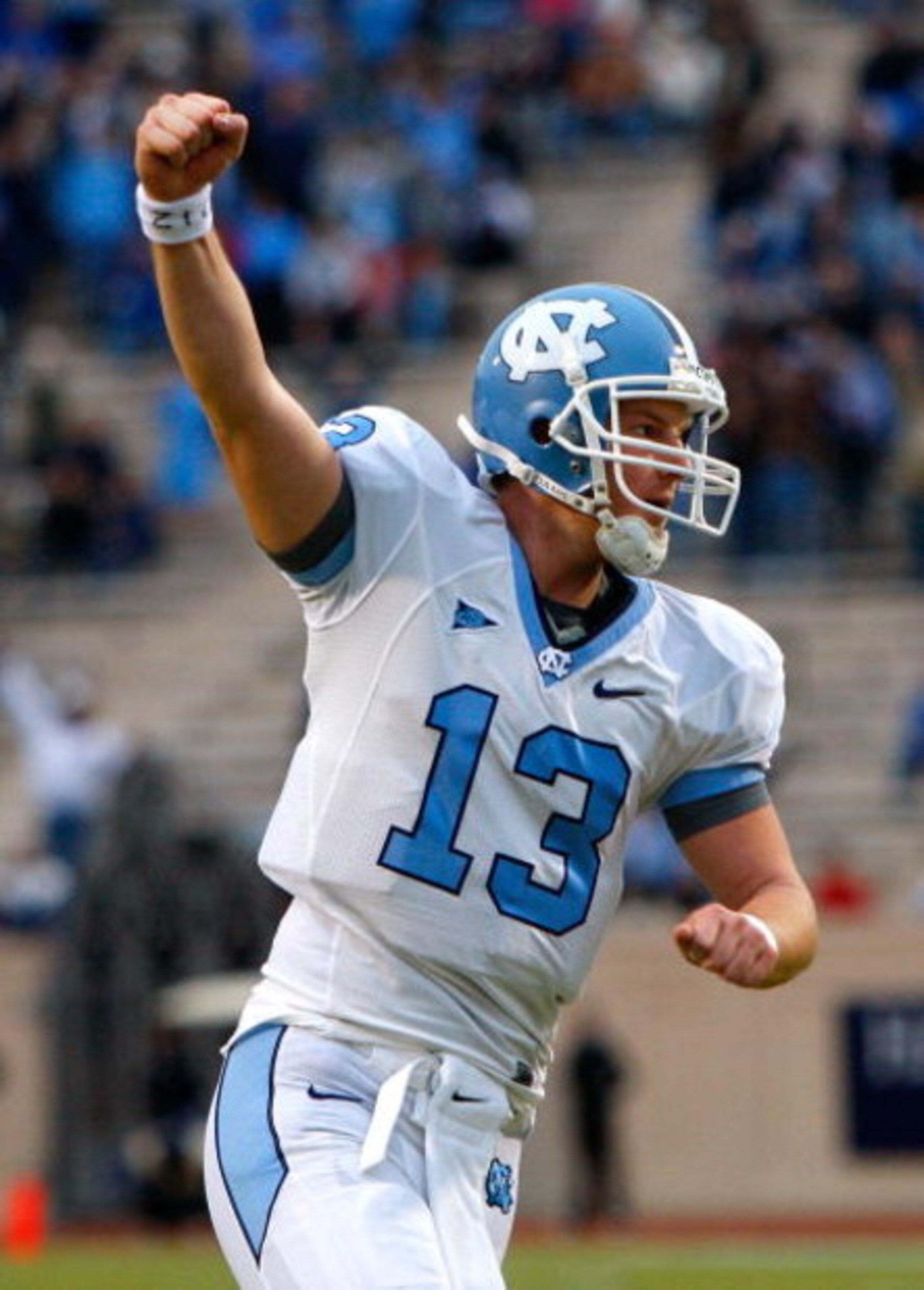 DURHAM, NC - NOVEMBER 29: Quarterback T.J. Yates #13 of the North Carolina Tar Heels celebrates after a touchdown against the Duke Blue Devils during the game at Wallace Wade Stadium on November 29, 2008 in Durham, North Carolina. (Photo by Kevin C. Cox DURHAM, NC - NOVEMBER 29: Quarterback T.J. Yates #13 of the North Carolina Tar Heels celebrates after a touchdown against the Duke Blue Devils during the game at Wallace Wade Stadium on November 29, 2008 in Durham, North Carolina. (Photo by Kevin C. Cox