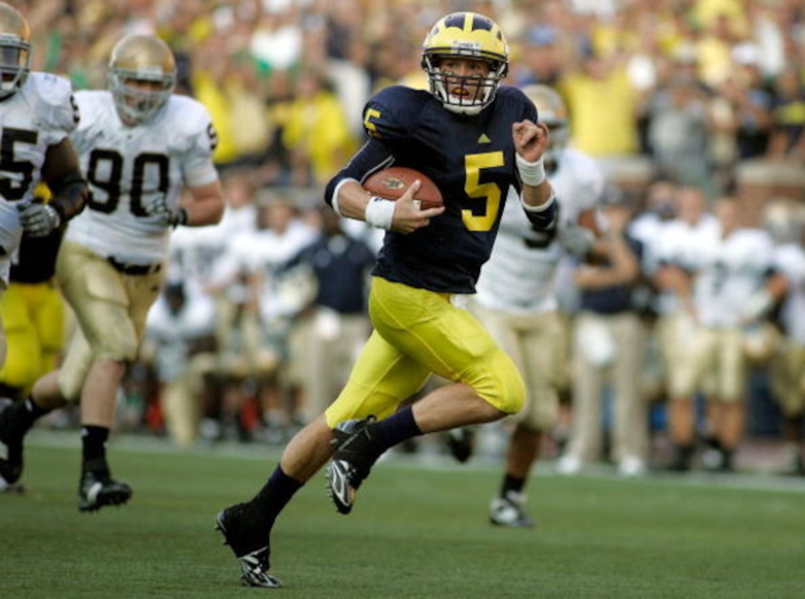 ANN ARBOR, MI - SEPTEMBER 12: Quarterback Tate Forcier #5 of Michigan runs for a touchdown late in the fourth quarter against Notre Dame at Michigan Stadium on September 12, 2009 in Ann Arbor, Michigan. (Photo by Domenic Centofanti/Getty Images) ANN ARBOR, MI - SEPTEMBER 12: Quarterback Tate Forcier #5 of Michigan runs for a touchdown late in the fourth quarter against Notre Dame at Michigan Stadium on September 12, 2009 in Ann Arbor, Michigan. (Photo by Domenic Centofanti/Getty Images)