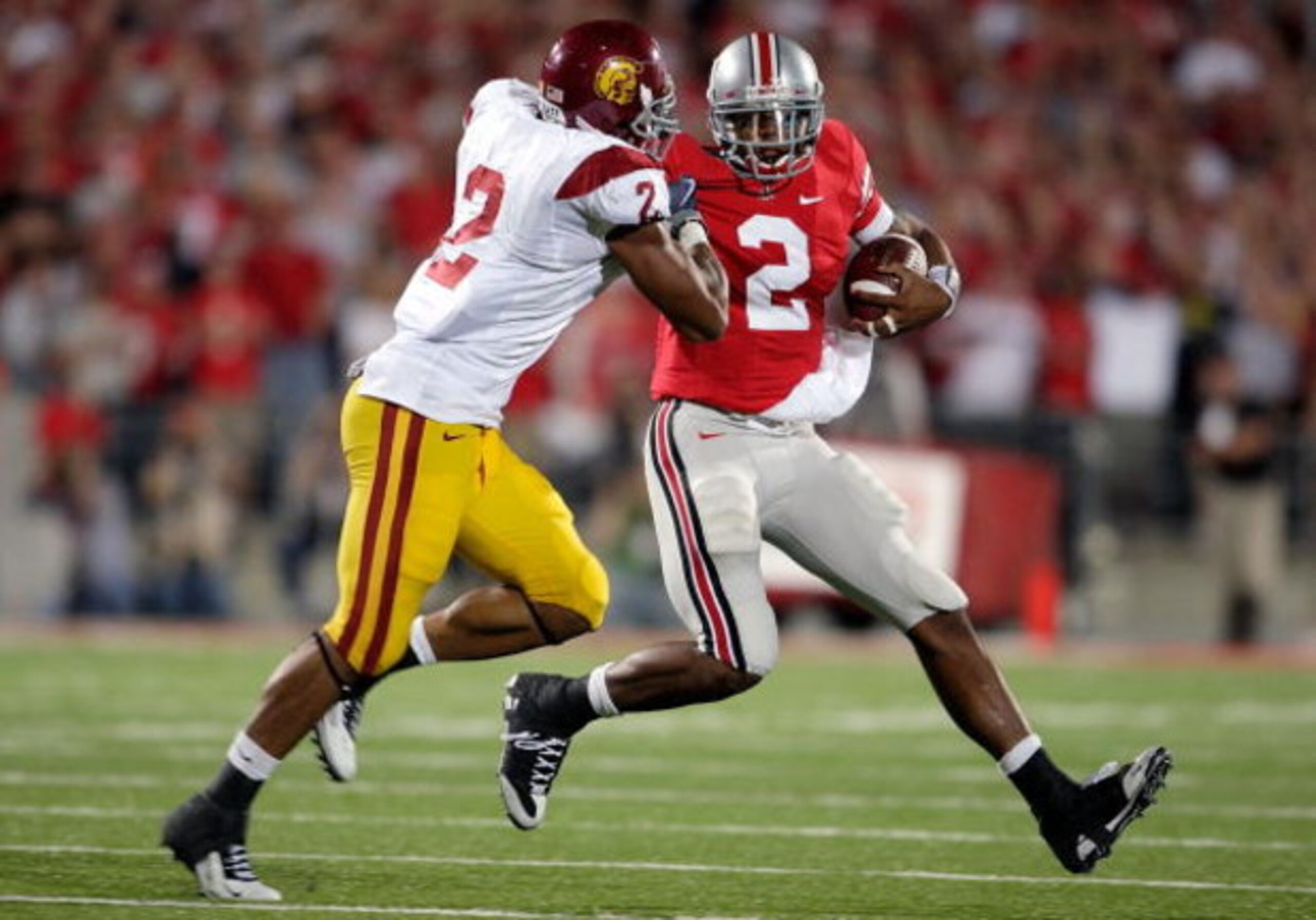 COLUMBUS, OH - SEPTEMBER 12:  Terrelle Pryor #2 of the Ohio State Buckeyes runs with the ball while defended by Taylor Mays #2 of the USC Trojans at Ohio Stadium on September 12, 2009 in Columbus, Ohio.  (Photo by Andy Lyons/Getty Images)