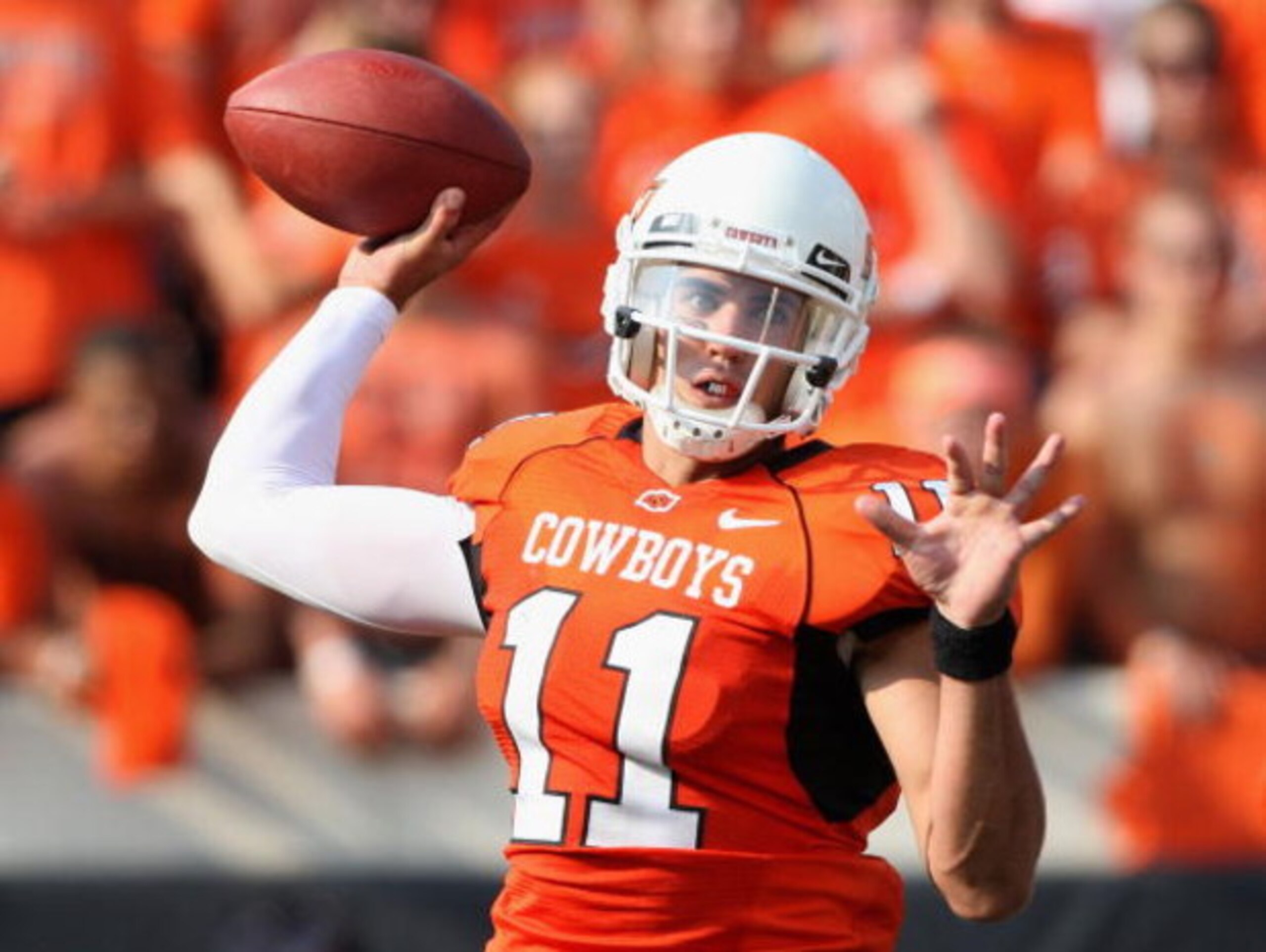 STILLWATER, OK - SEPTEMBER 05:  Quarterback Zac Robinson #11 of the Oklahoma State Cowboys throws a pass during the college football game against the Georgia Bulldogs at Boone Pickens Stadium on September 5, 2009 in Stillwater, Oklahoma.  The Cowboys defe