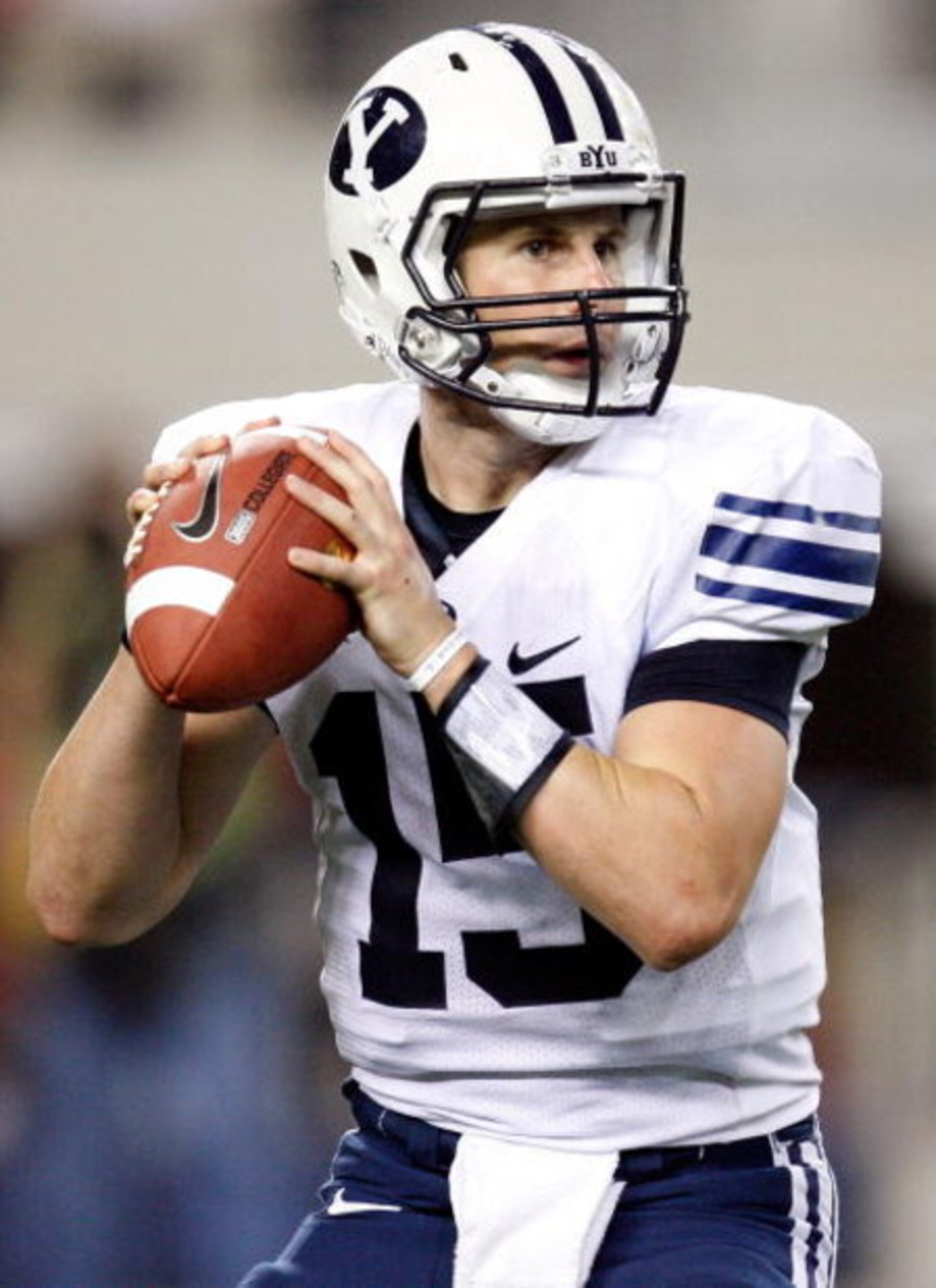 ARLINGTON, TX - SEPTEMBER 05:  Quarterback Max Hall #15 of the Brigham Young Cougars drops back to pass against the Oklahoma Sooners at Cowboys Stadium on September 5, 2009 in Arlington, Texas.  (Photo by Ronald Martinez/Getty Images)