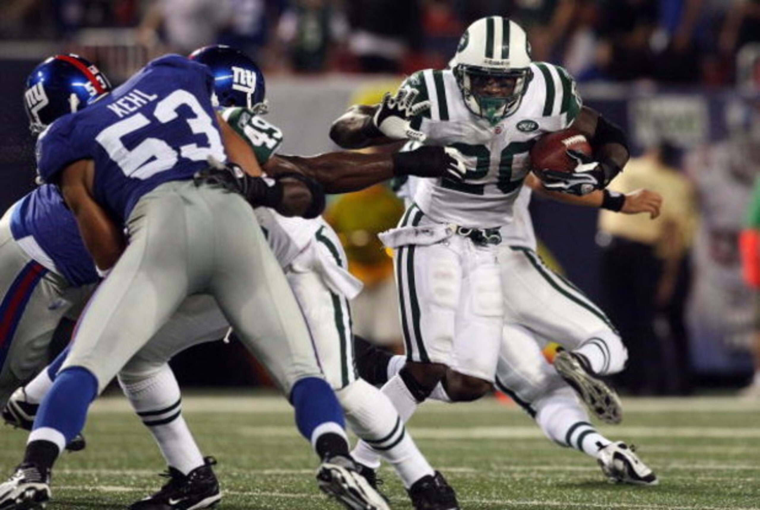 EAST RUTHERFORD, NJ - AUGUST 29:  Thomas Jones #20 of the New York Jets runs the ball against the New York Giants on August 29, 2009 at Giants Stadium in East Rutherford, New Jersey.  (Photo by Jim McIsaac/Getty Images)