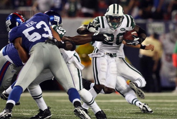 EAST RUTHERFORD, NJ - AUGUST 29:  Thomas Jones #20 of the New York Jets runs the ball against the New York Giants on August 29, 2009 at Giants Stadium in East Rutherford, New Jersey.  (Photo by Jim McIsaac/Getty Images)