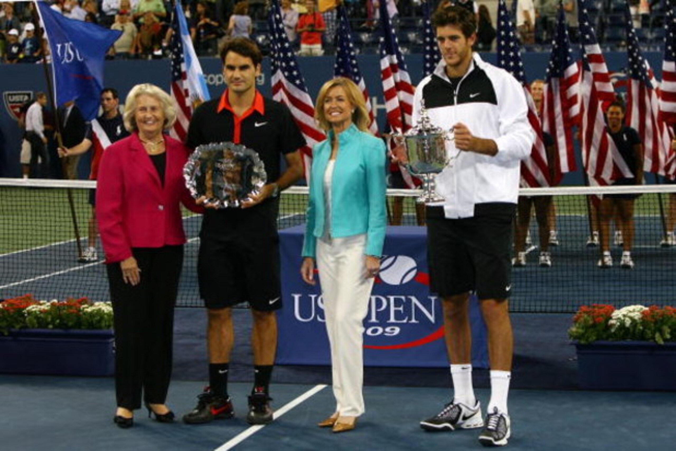 NEW YORK - SEPTEMBER 14: (L-R) USTA president Lucy S. Garvin, Roger Federer of Switzerland and Juan Martin Del Potro of Argentina pose with the trophies after the Men's Singles final on day fifteen of the 2009 U.S. Open at the USTA Billie Jean King Natio NEW YORK - SEPTEMBER 14: (L-R) USTA president Lucy S. Garvin, Roger Federer of Switzerland and Juan Martin Del Potro of Argentina pose with the trophies after the Men's Singles final on day fifteen of the 2009 U.S. Open at the USTA Billie Jean King Natio