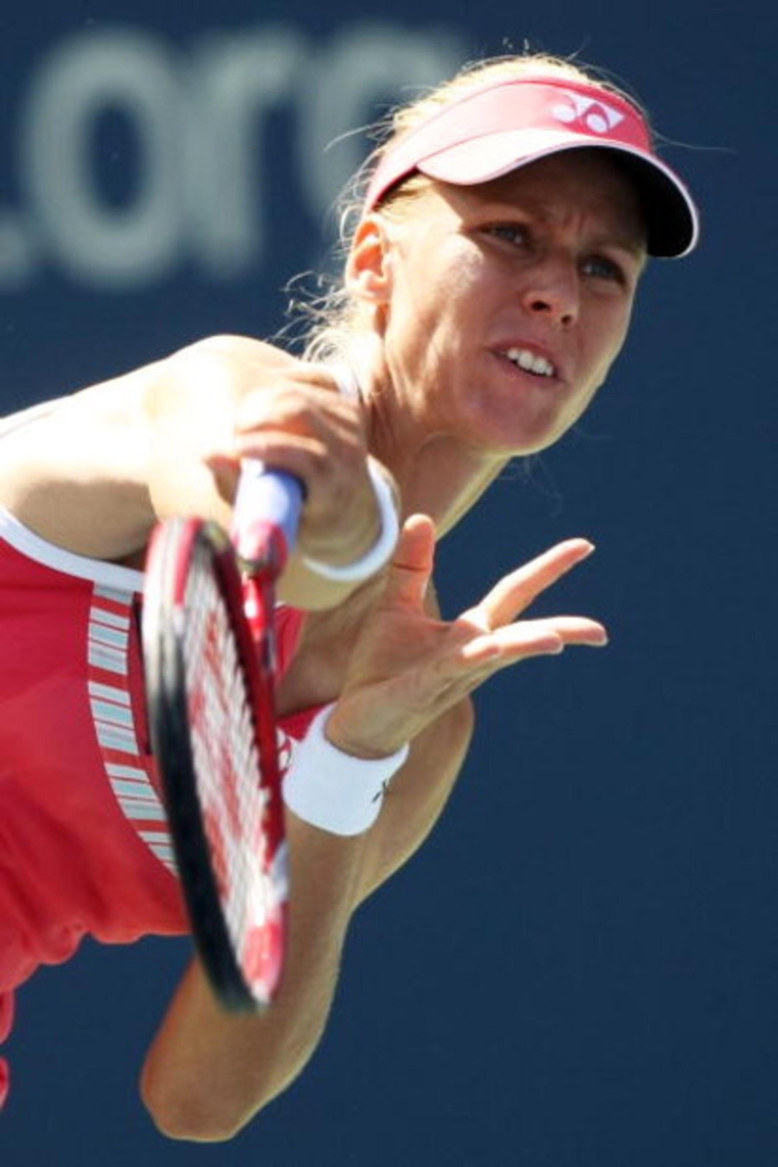 NEW YORK - SEPTEMBER 03: Elena Dementieva of Russia serves against Melanie Oudin during day four of the 2009 U.S. Open at the USTA Billie Jean King National Tennis Center on September 3, 2009 in Flushing neighborhood of the Queens borough of New York Cit NEW YORK - SEPTEMBER 03: Elena Dementieva of Russia serves against Melanie Oudin during day four of the 2009 U.S. Open at the USTA Billie Jean King National Tennis Center on September 3, 2009 in Flushing neighborhood of the Queens borough of New York Cit